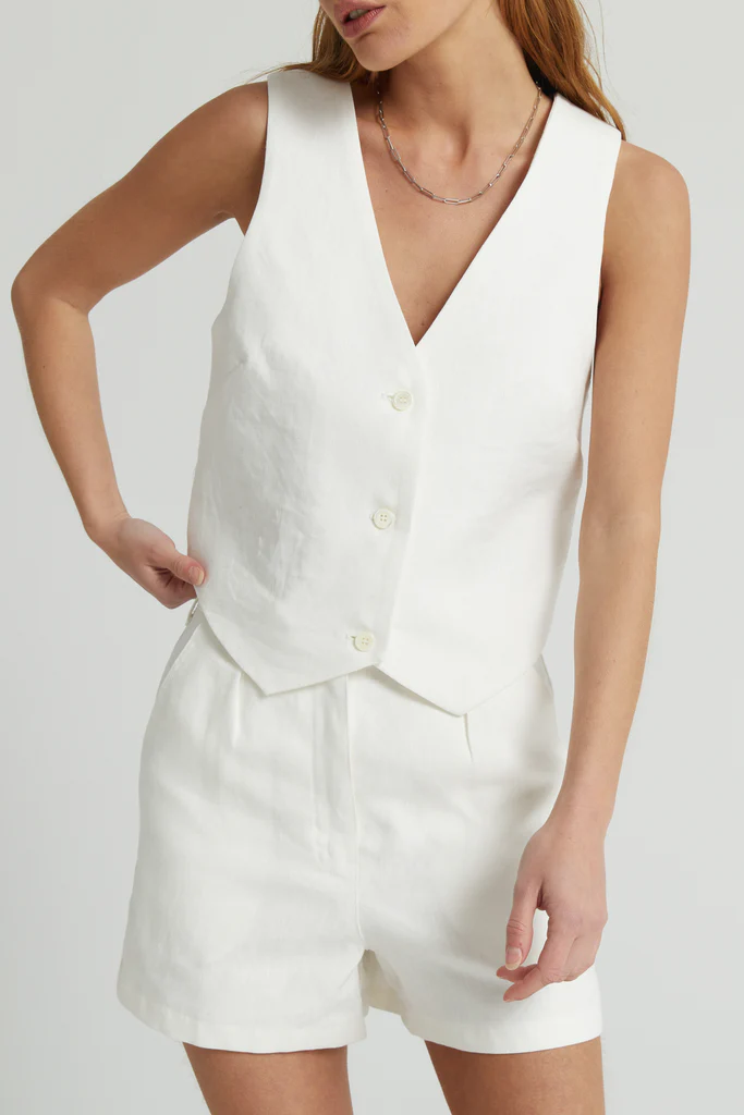 White sleeveless top and shorts set on a plain background