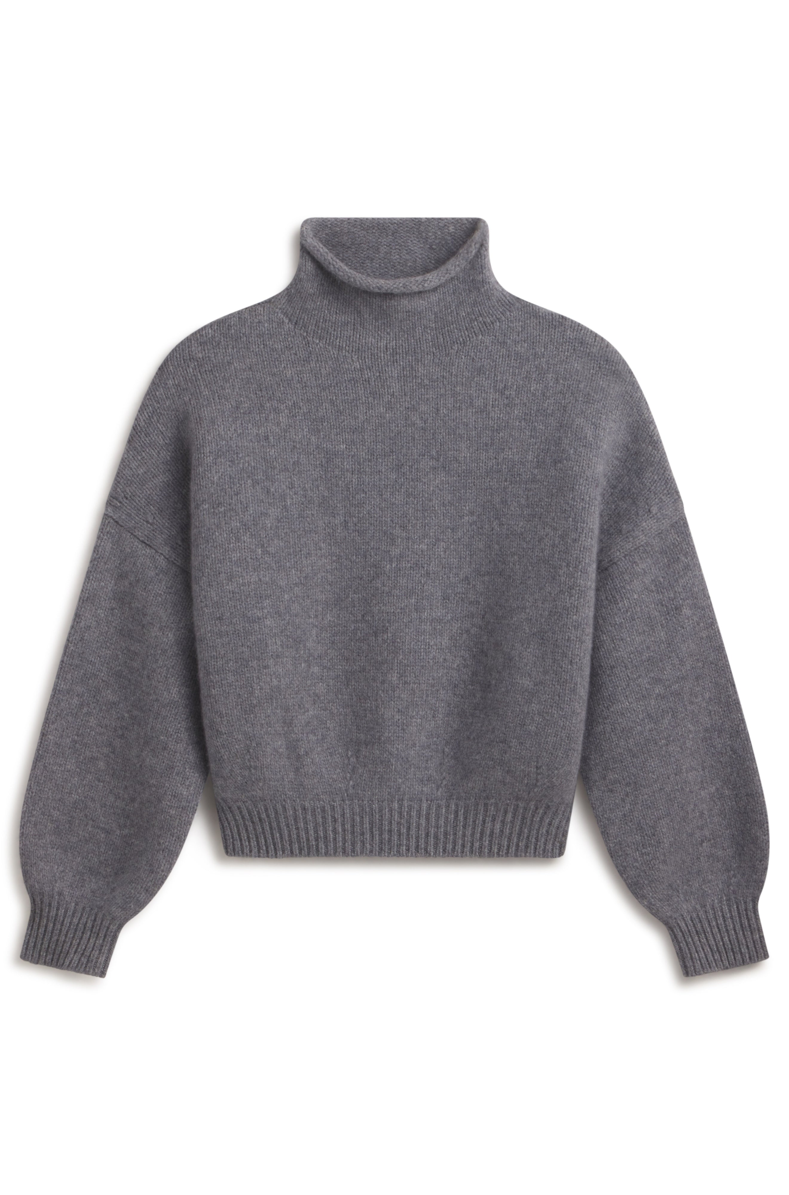 A dark gray knit turtleneck sweater with long sleeves and ribbed cuffs and hem, shown against a plain white background.