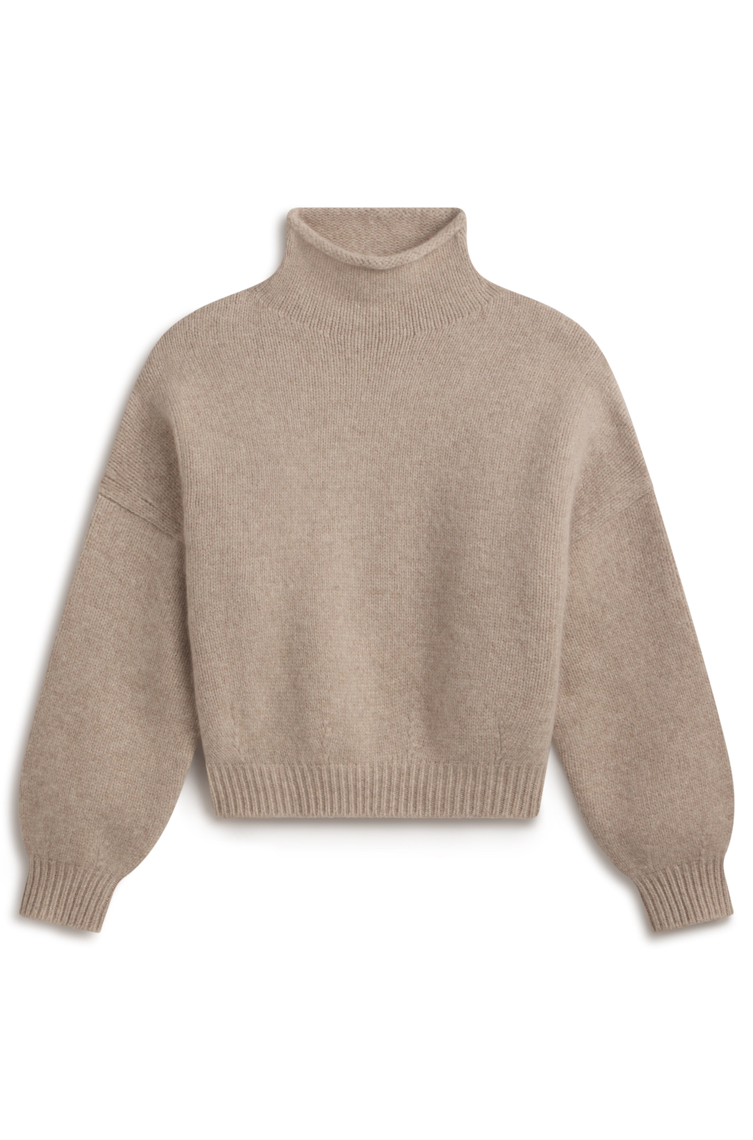 A light beige knit turtleneck sweater with a relaxed fit, displayed flat against a solid white background.