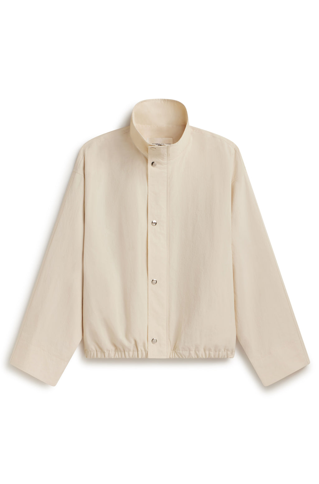 Cream ivory high neck jacket with button up front against a white background