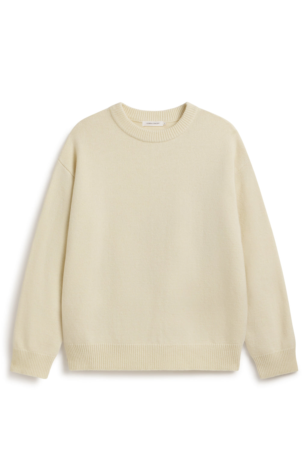 Crewneck yellow oversized wool and cashmere sweater on a white background