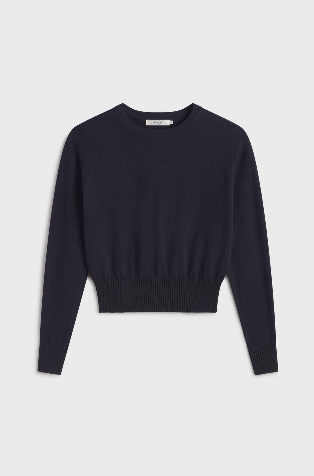 Navy long sleeve sweater on a light gray background