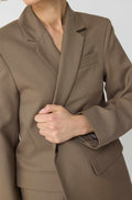 Woman wearing a brown blazer