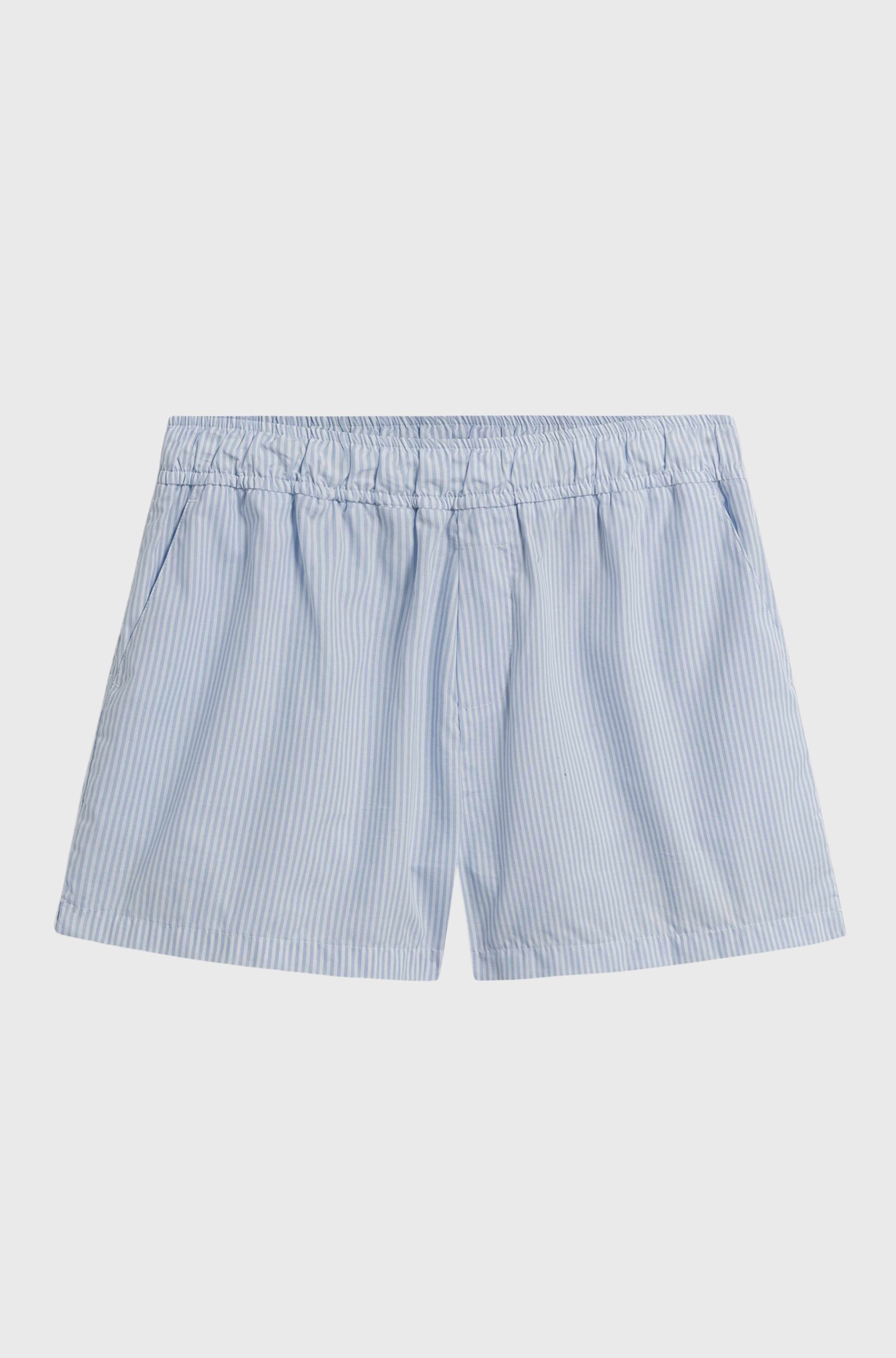 Blue and white striped shorts on a light gray background