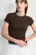 Woman wearing a brown t-shirt with a white background
