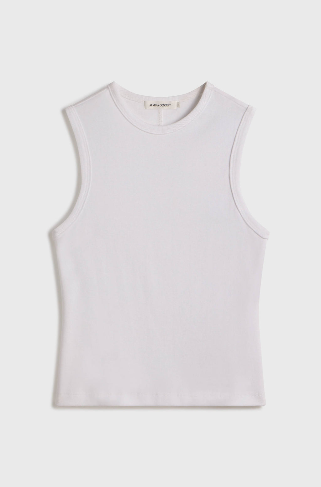 White sleeveless top on a light beige background