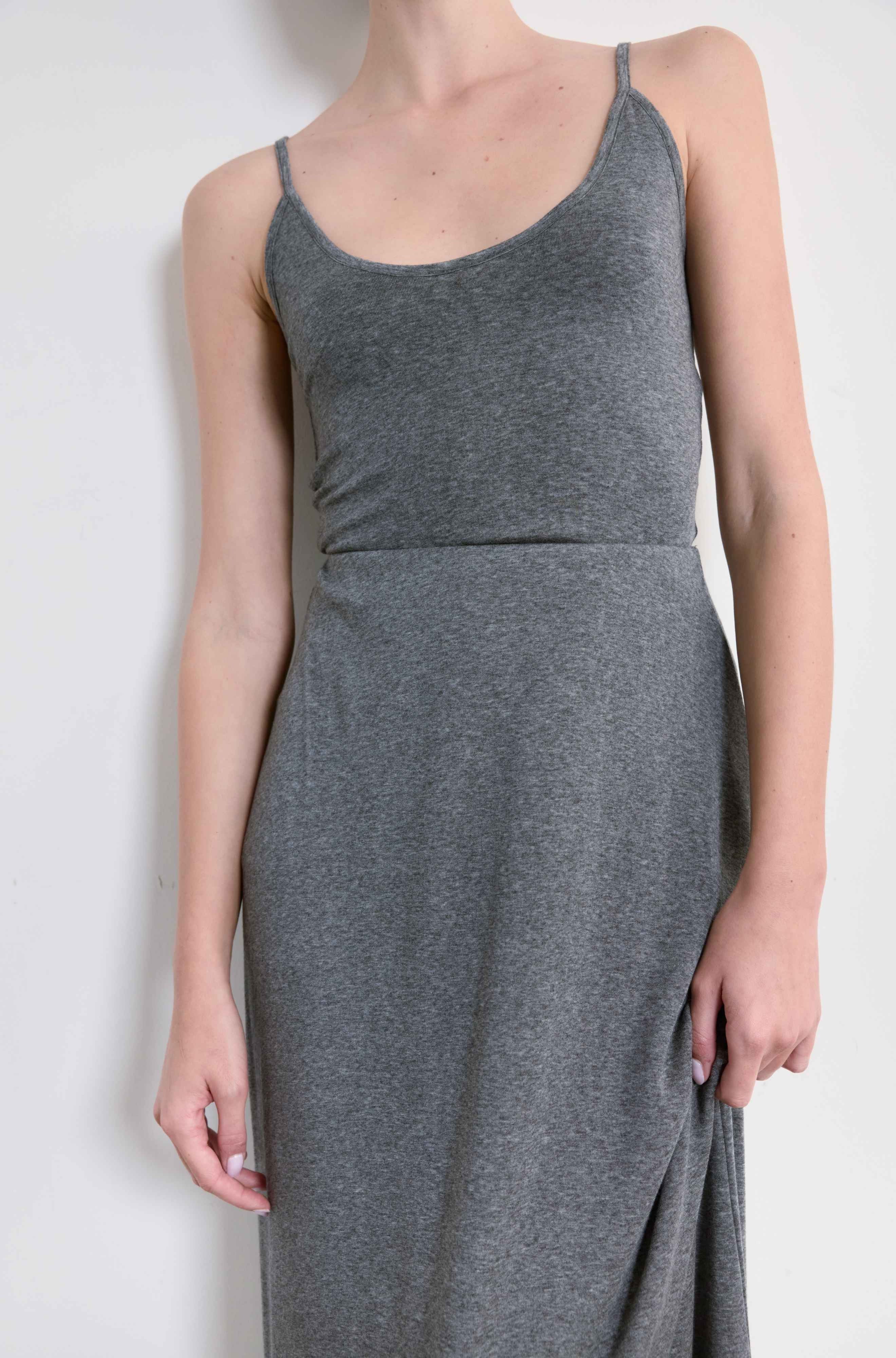 Gray tank and matching skirt worn by a person on a white background