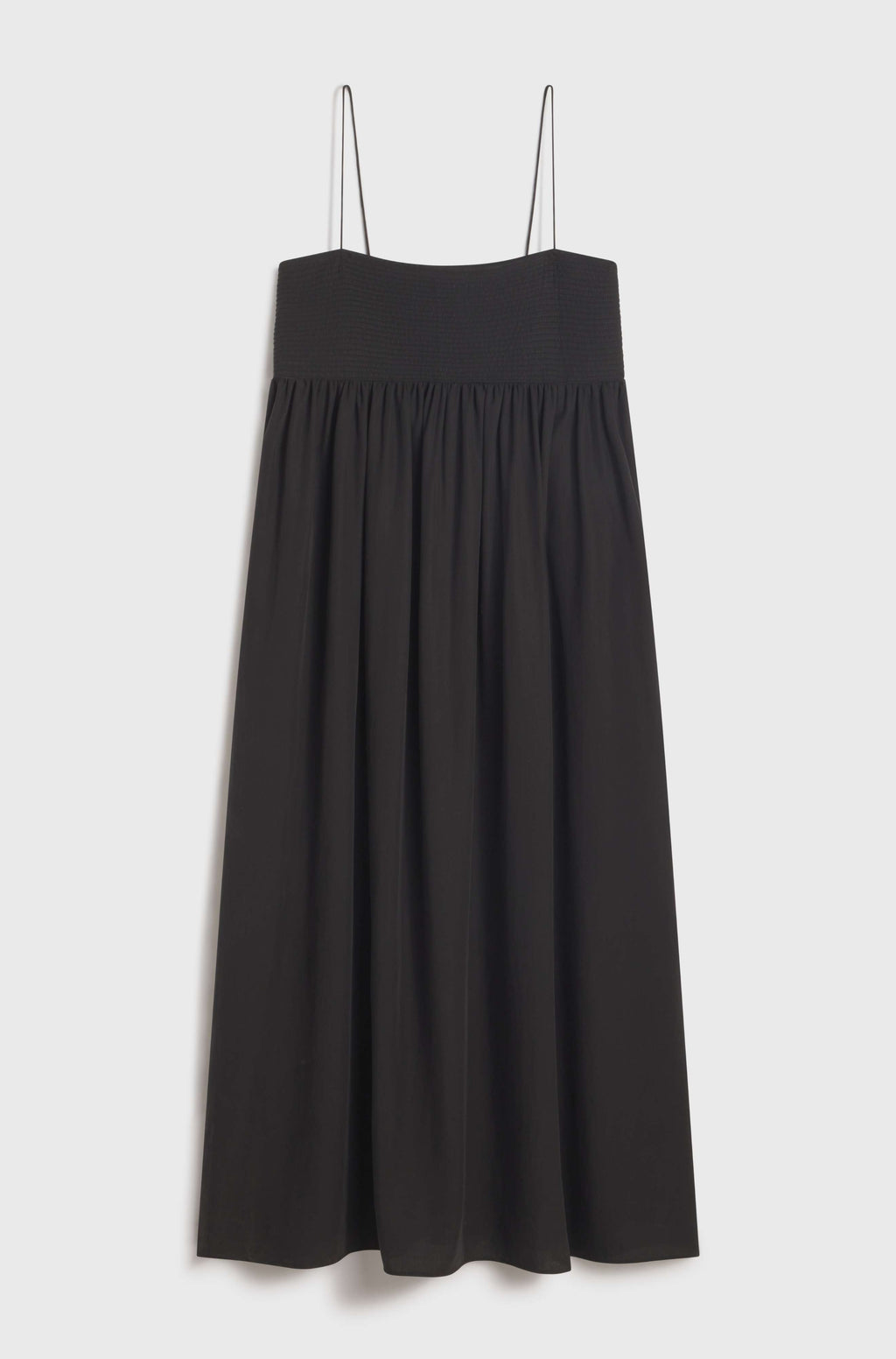 Black dress with thin straps on a light gray background