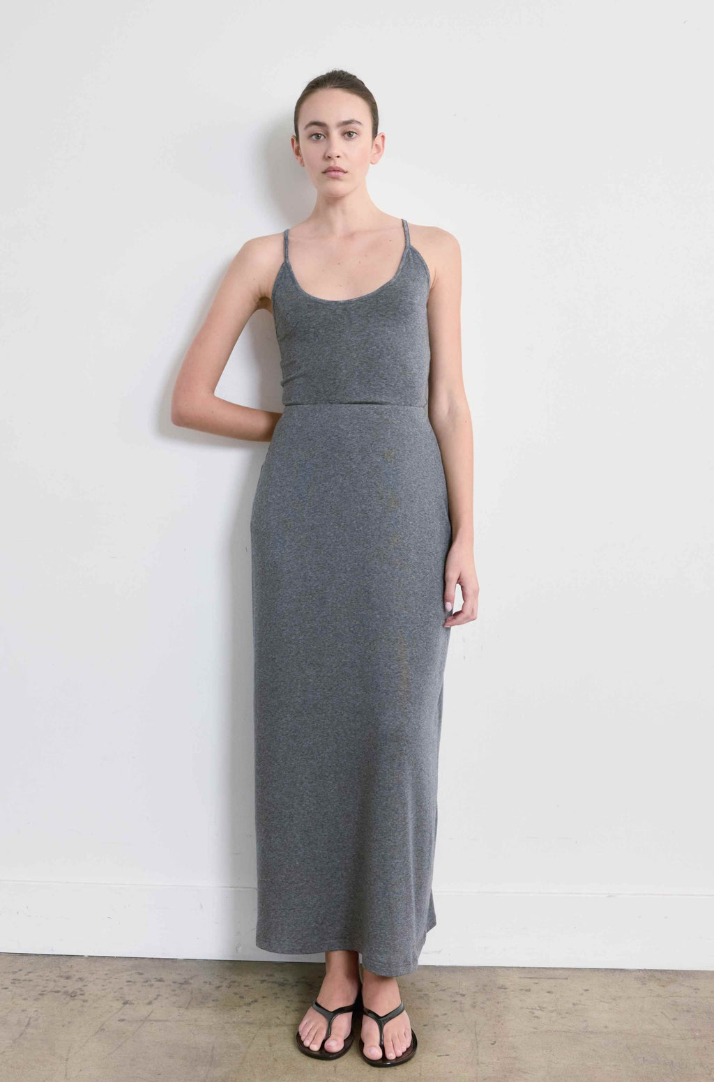 Woman wearing a grey skirt with a matching tank