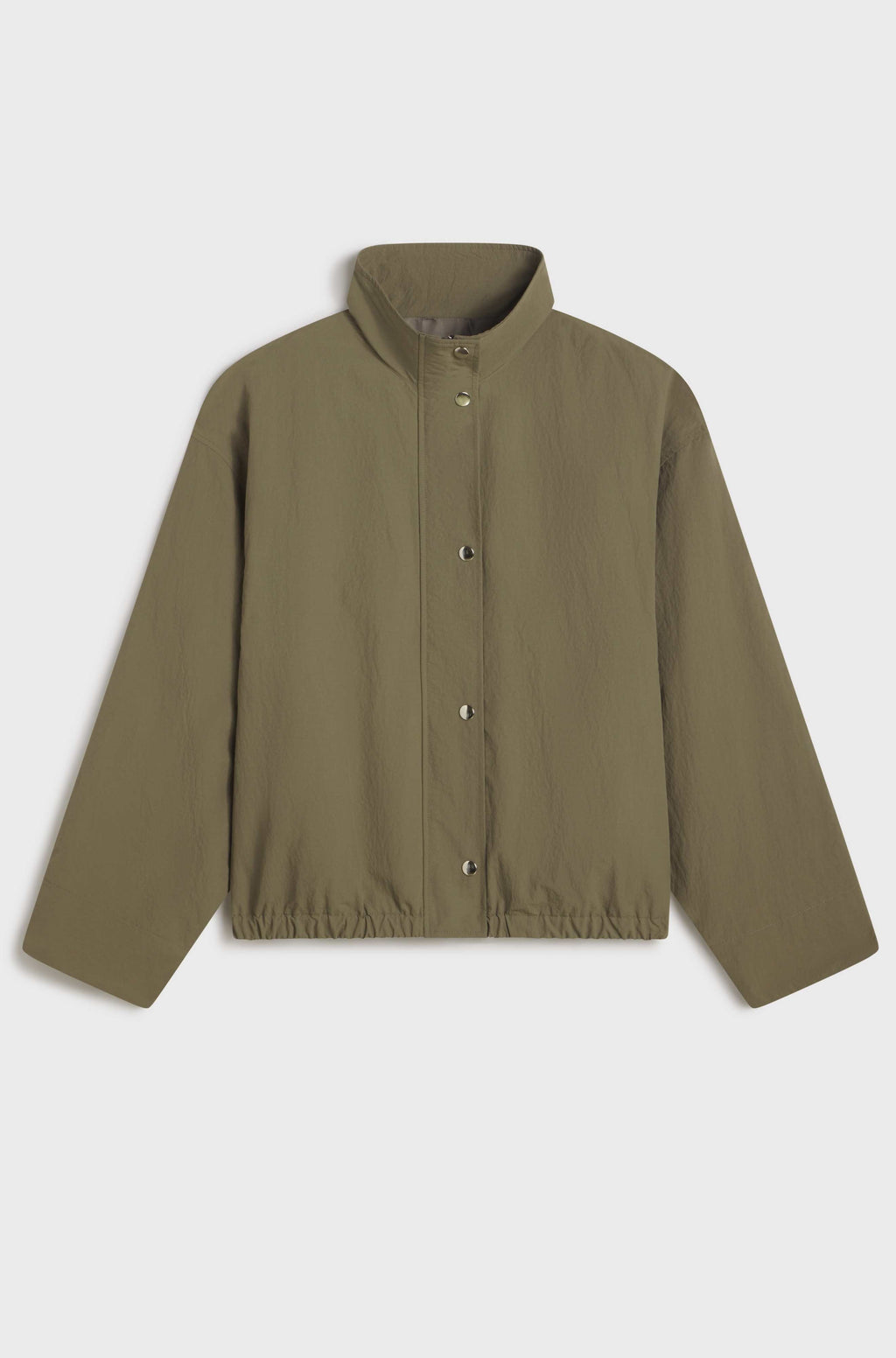 Green button up jacket on light grey background