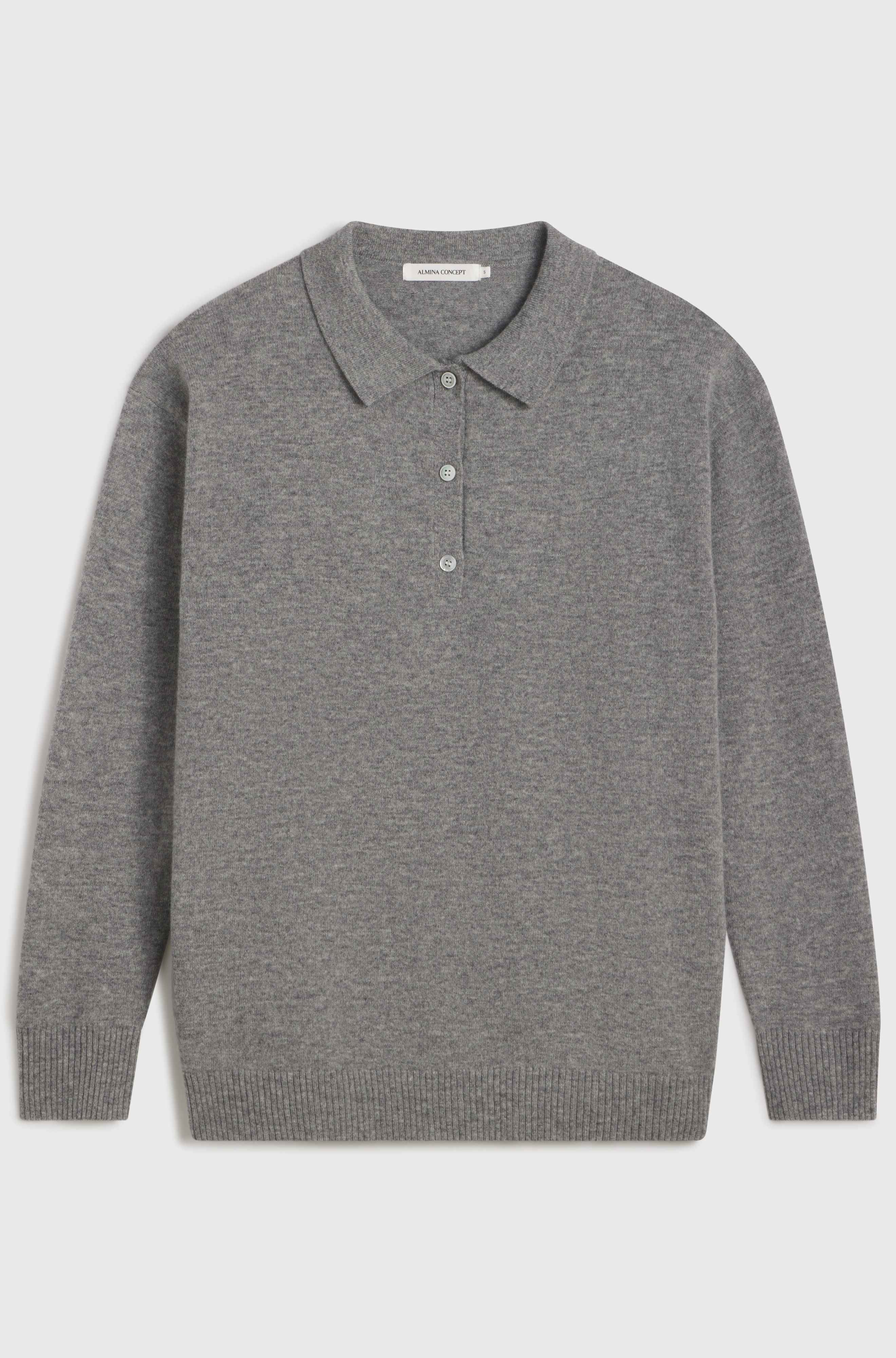 Grey polo wool sweater on light grey background