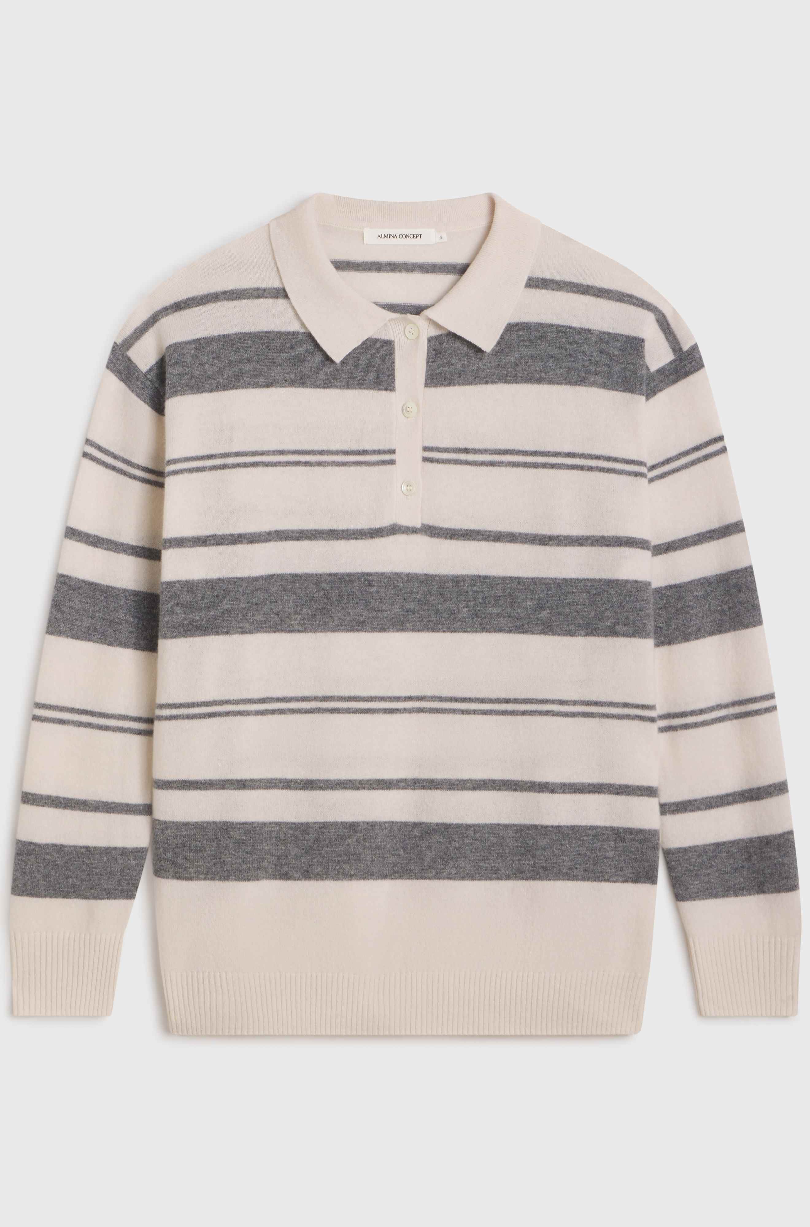 White and grey stripe wool sweater on light grey background