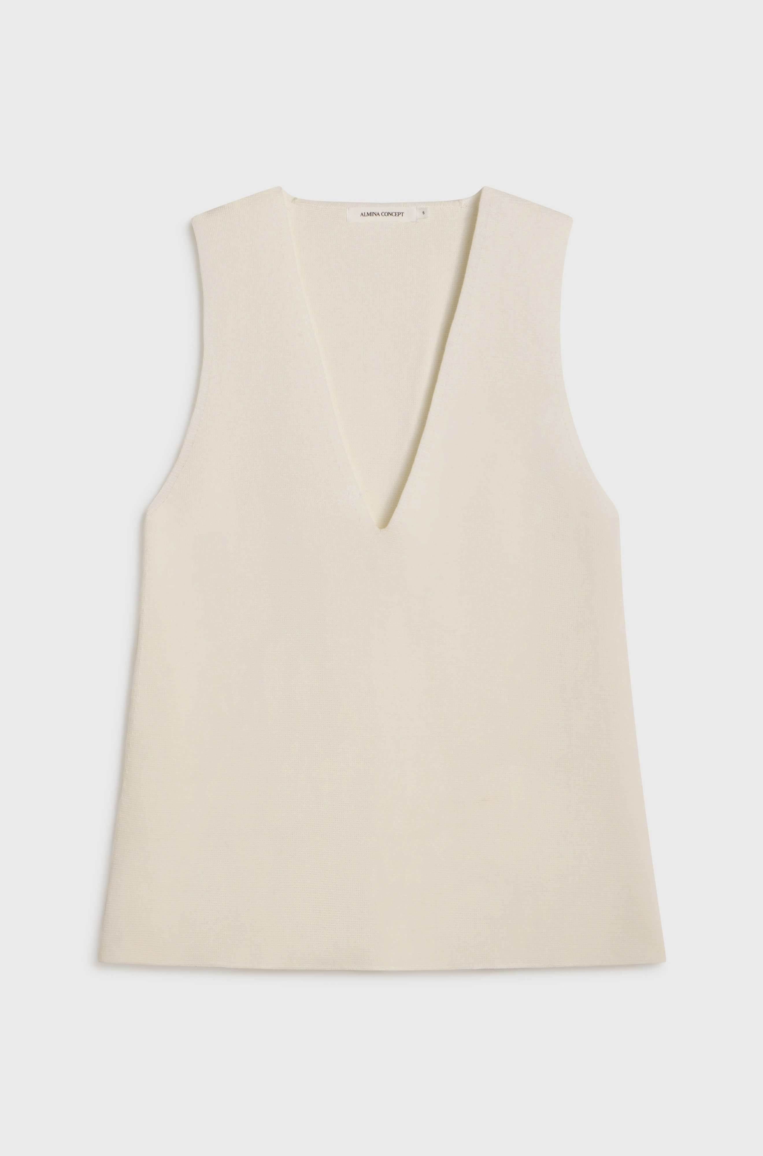 White sleeveless top on a white background