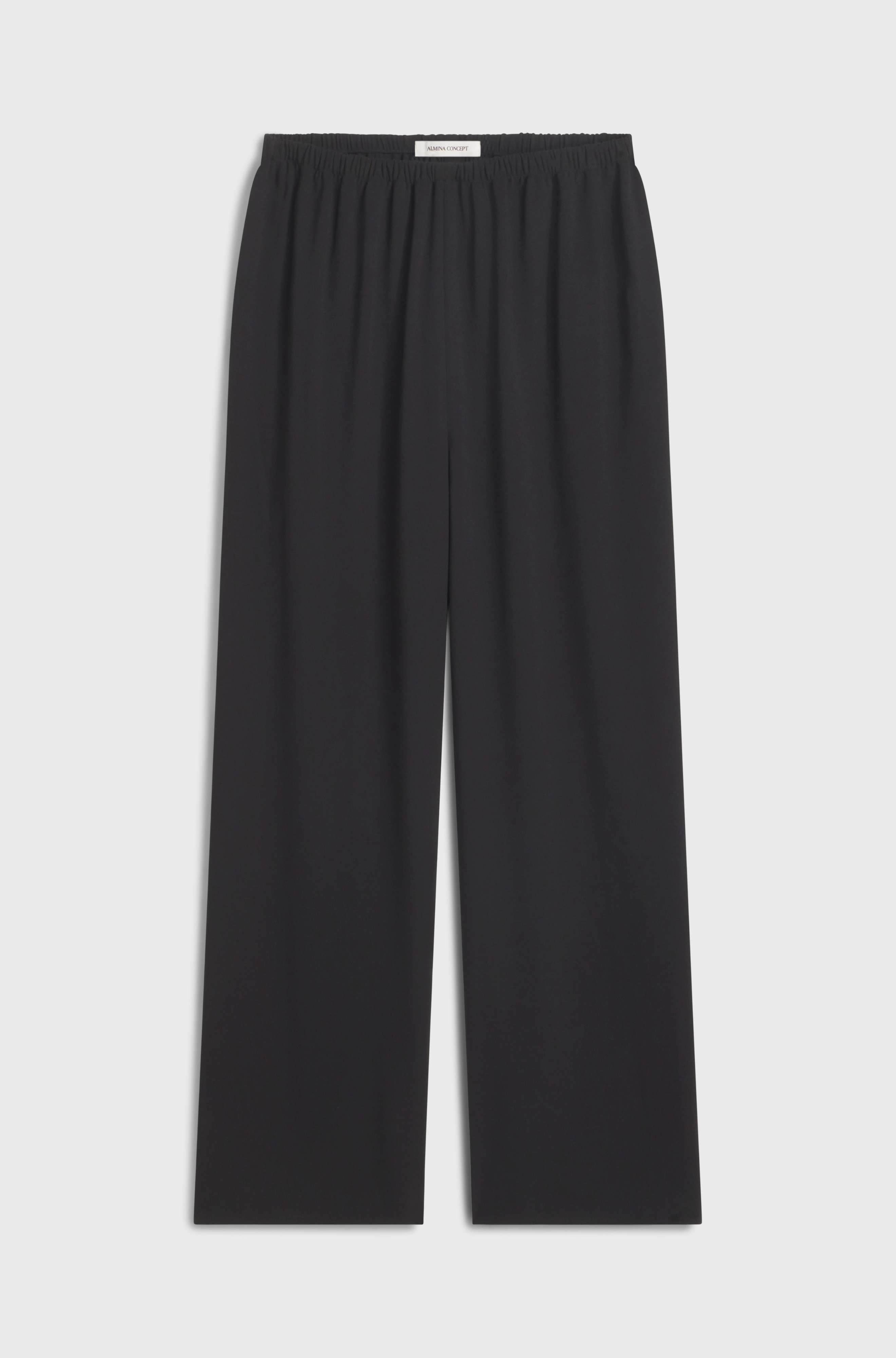 Black pants on a light gray background