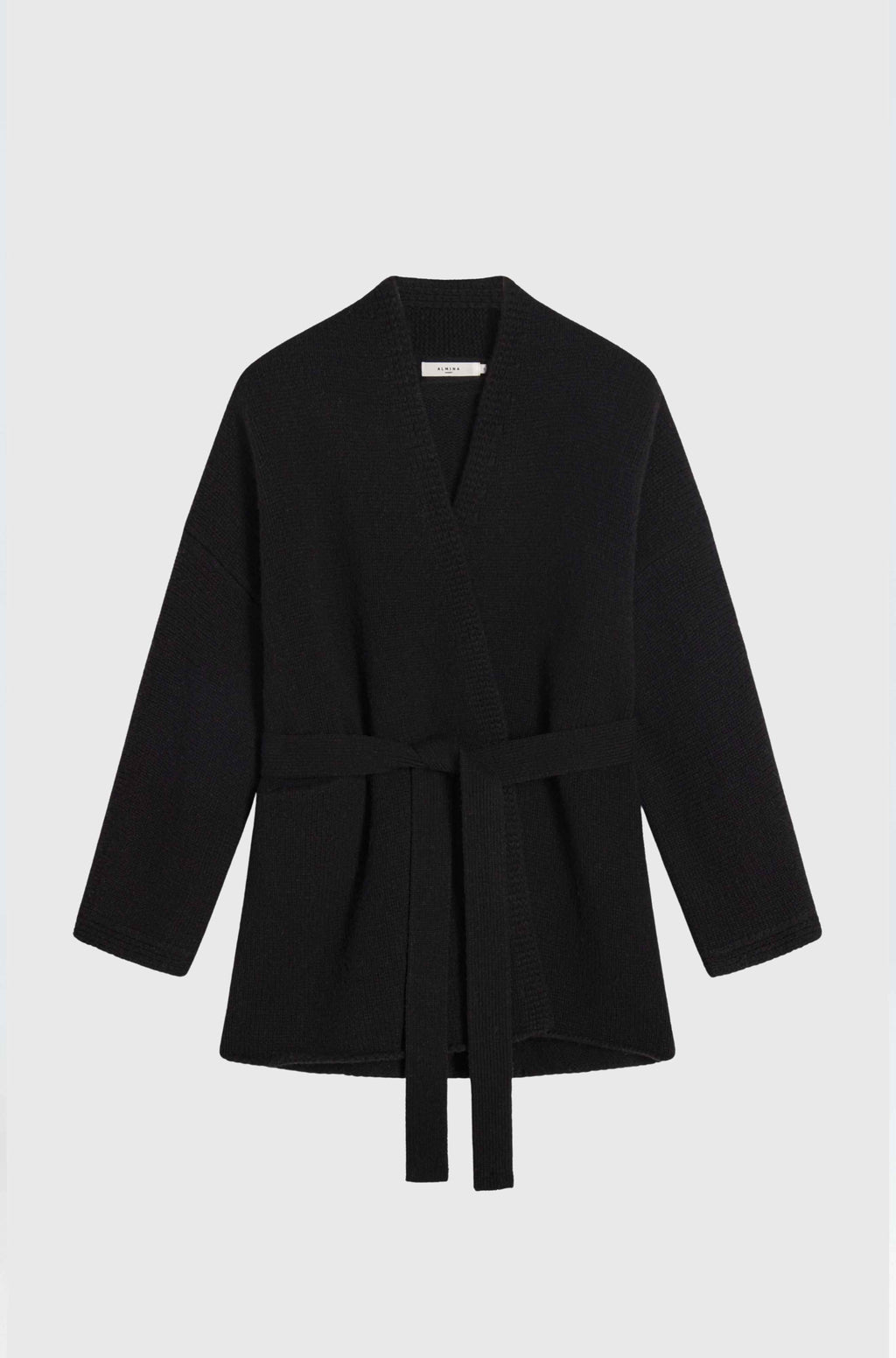Black coat with a belt on a light gray background