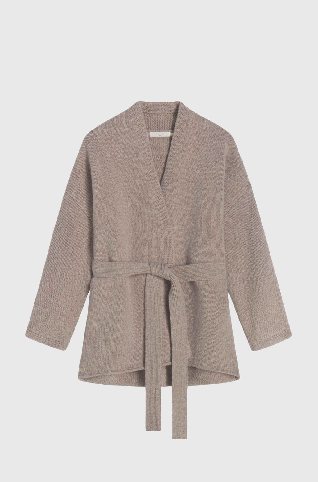 Beige wool sweater with a belt on a light gray background