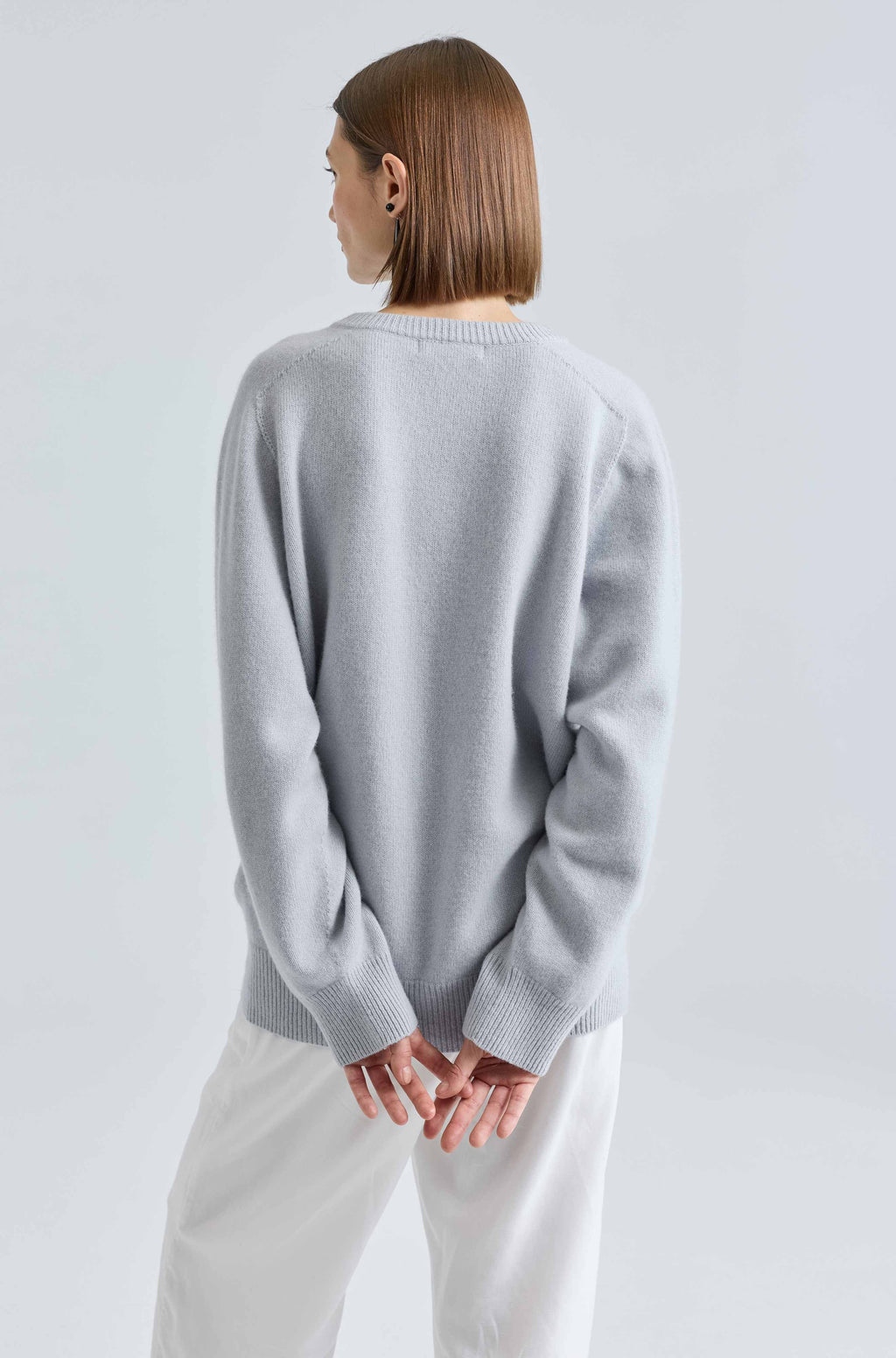 Woman wearing a light blue wool sweater