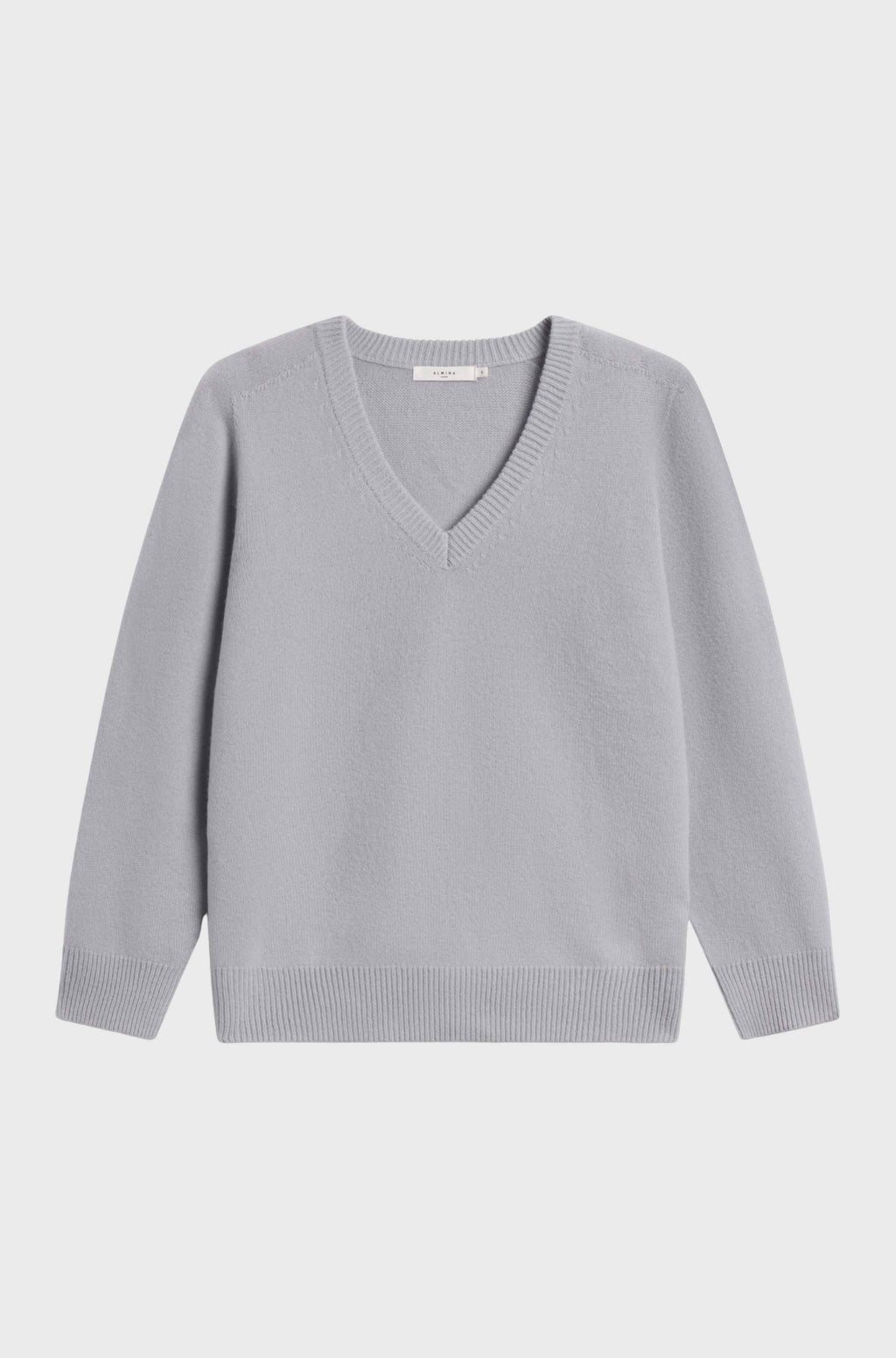 Wool v-neck sweater light blue sweater against a grey background