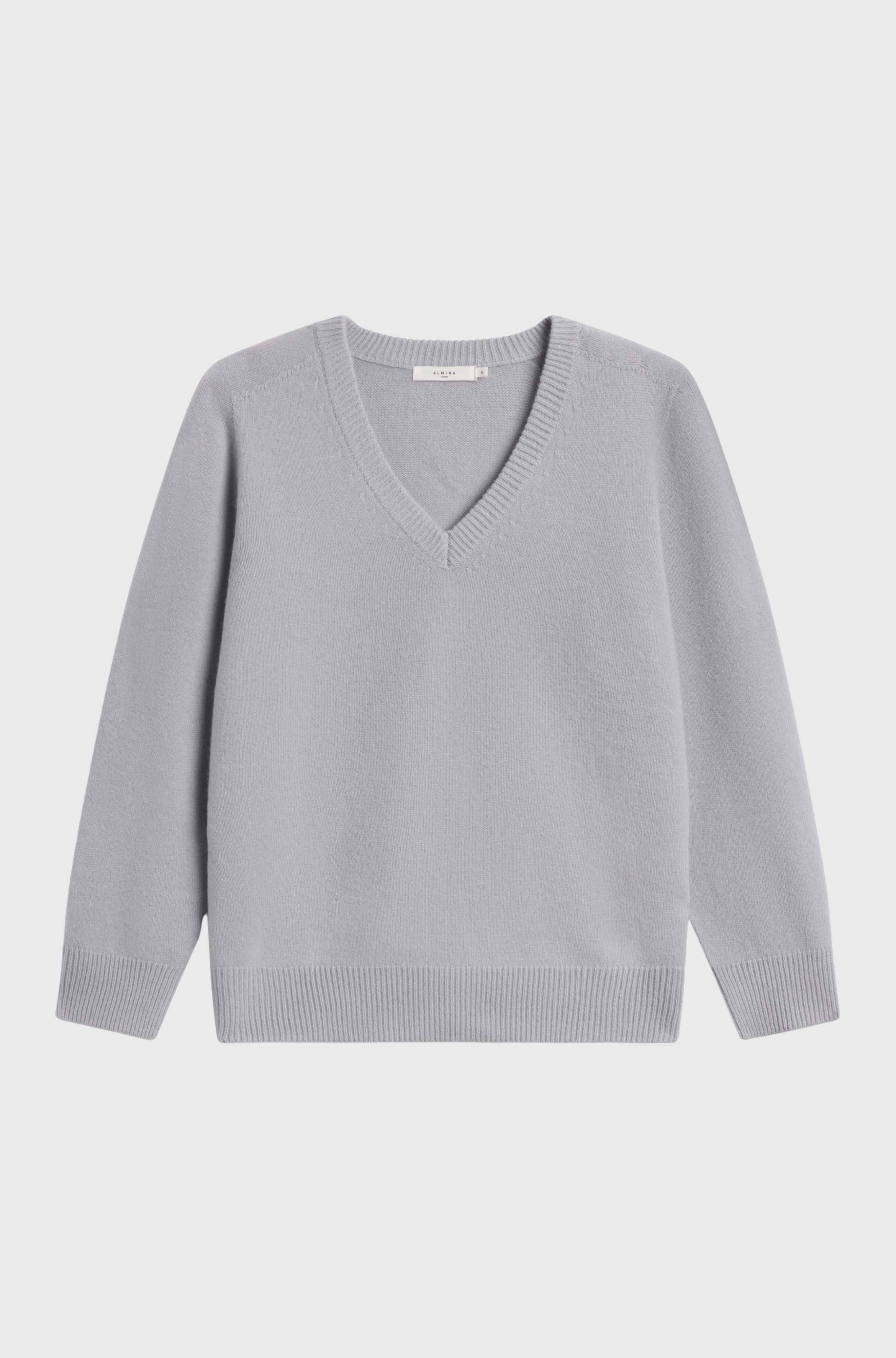 Wool v-neck sweater light blue sweater against a grey background