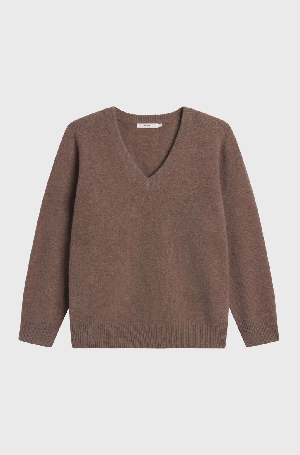 Brown sweater on a light gray background