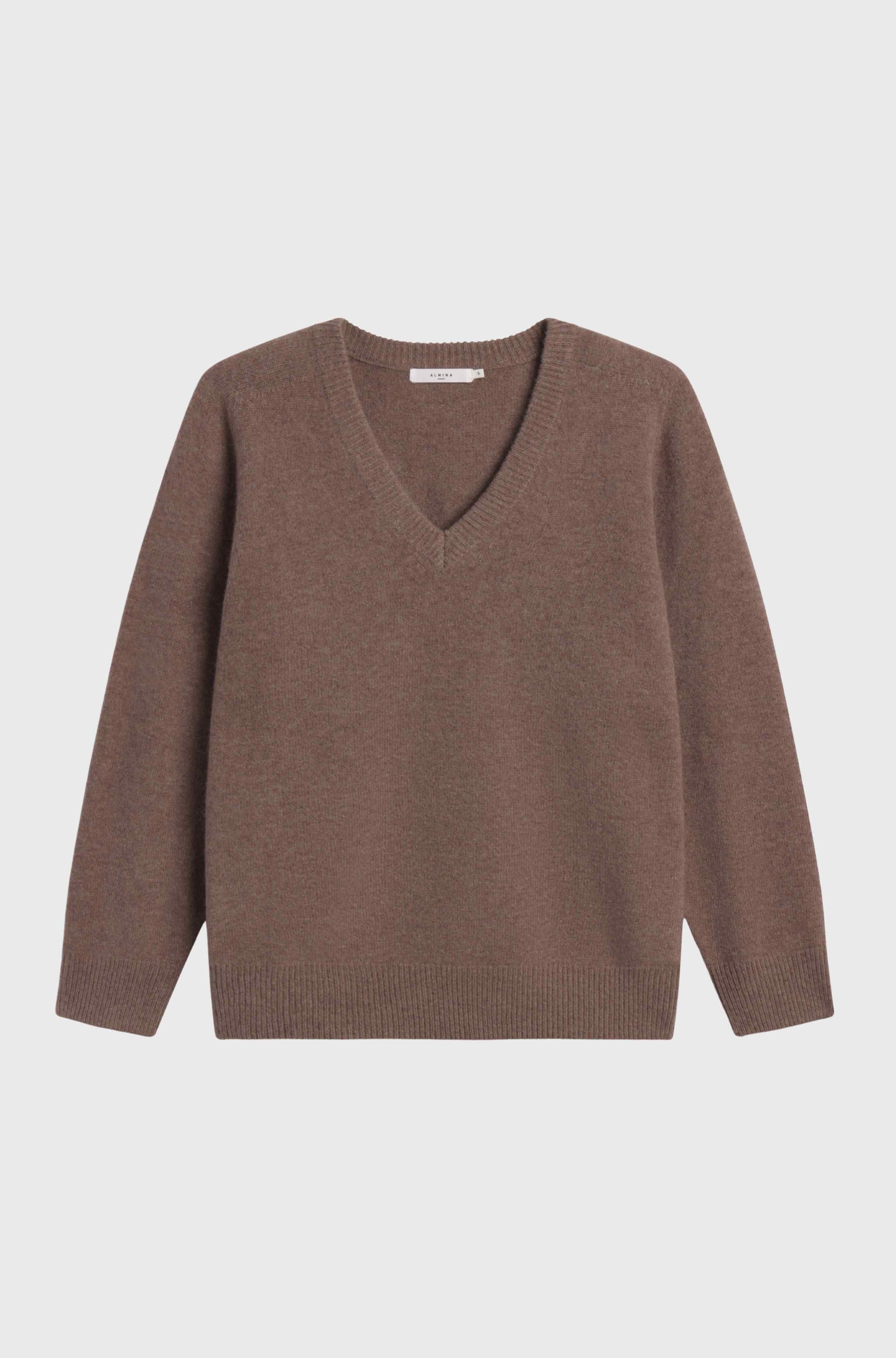 Brown sweater on a light gray background