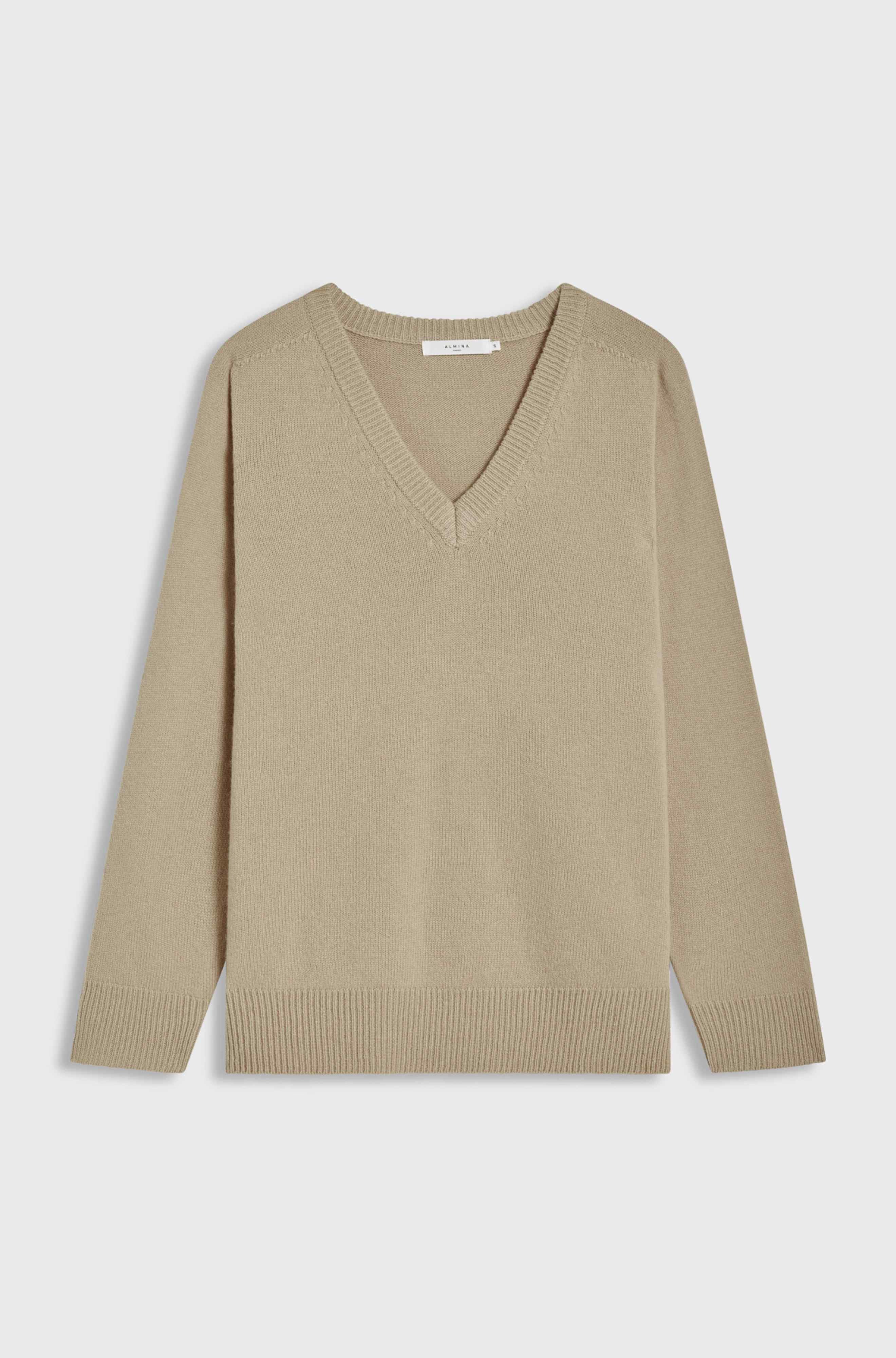 Beige sweater on a light gray background