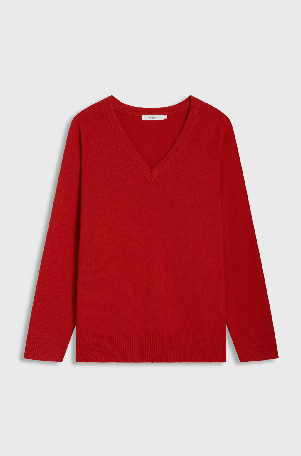 Red sweater on a light gray background