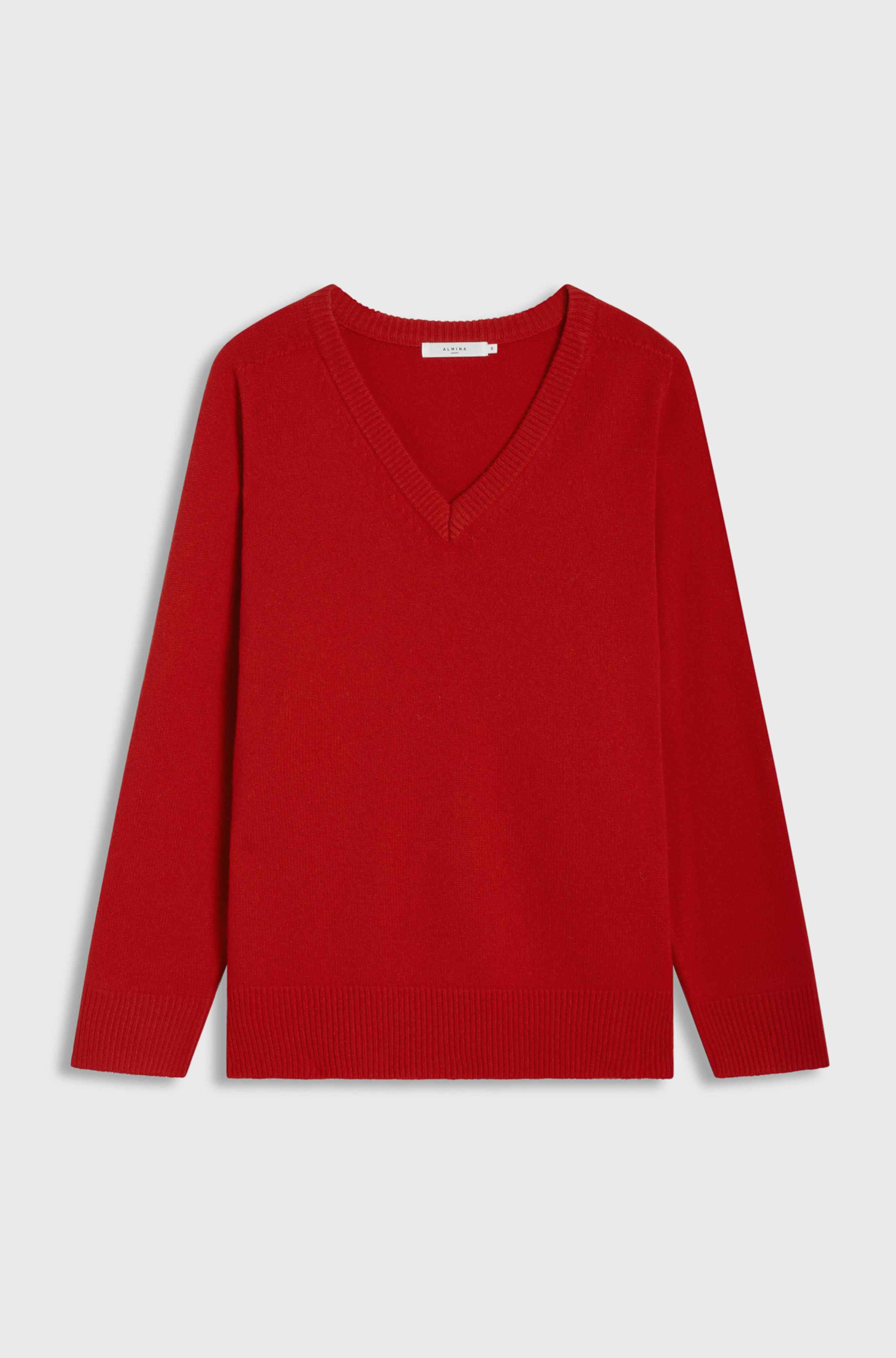 Red sweater on a light gray background