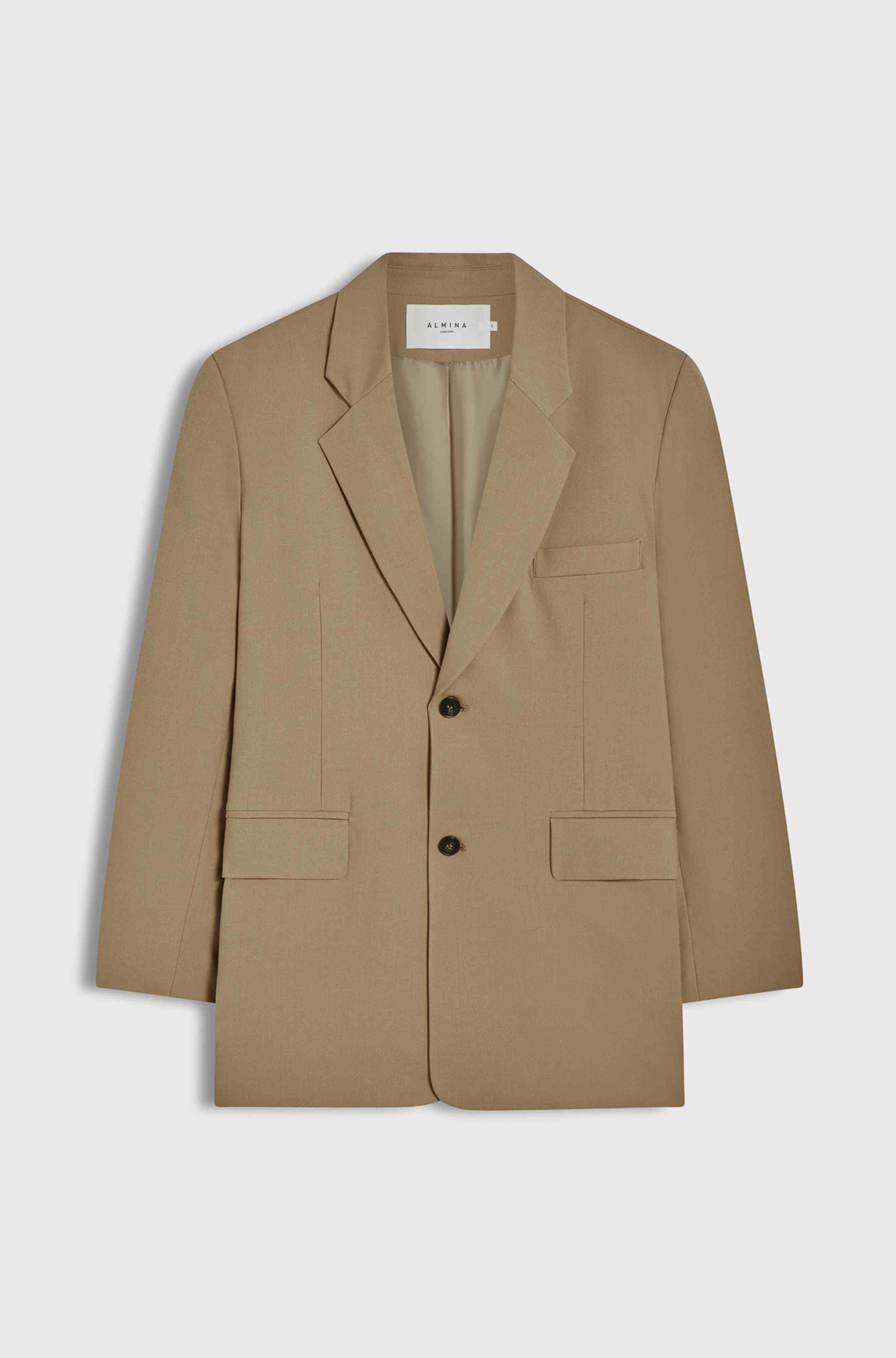 Beige blazer with a brand label on a light gray background