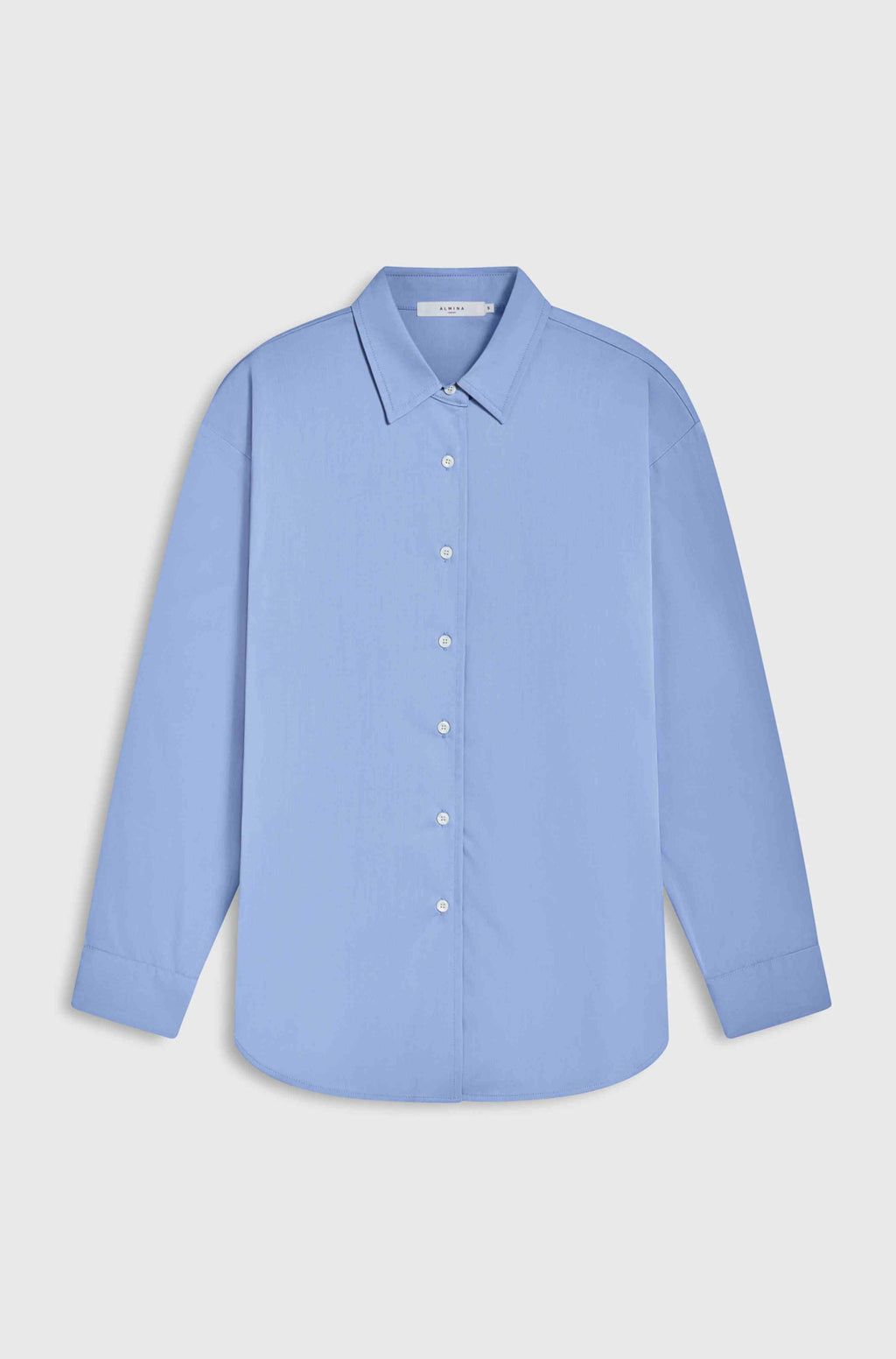 Light blue shirt on a light gray background