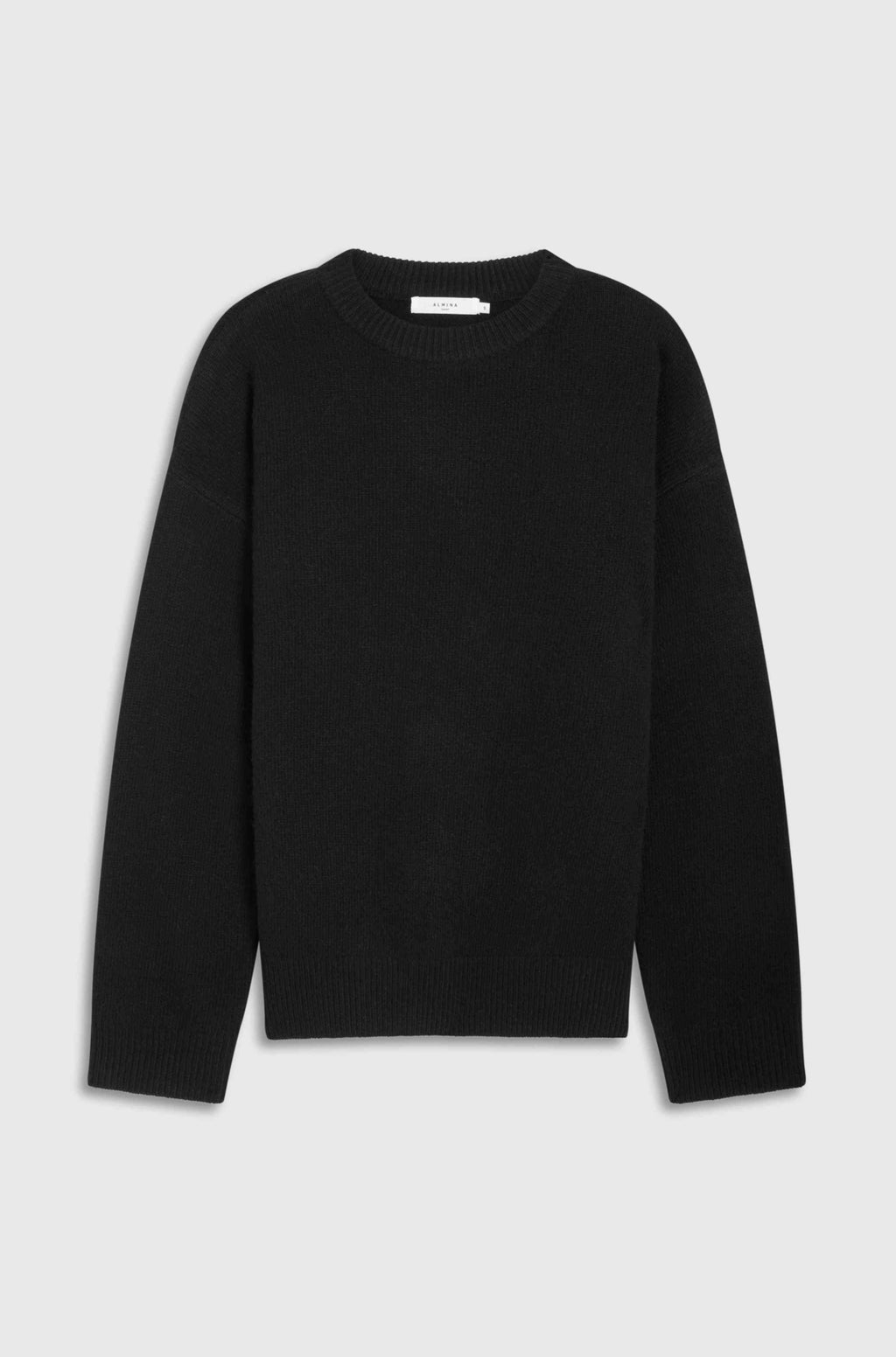 Black sweater on a light gray background