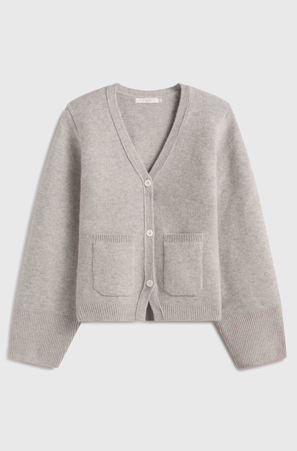 Gray cardigan with button details on a light gray background