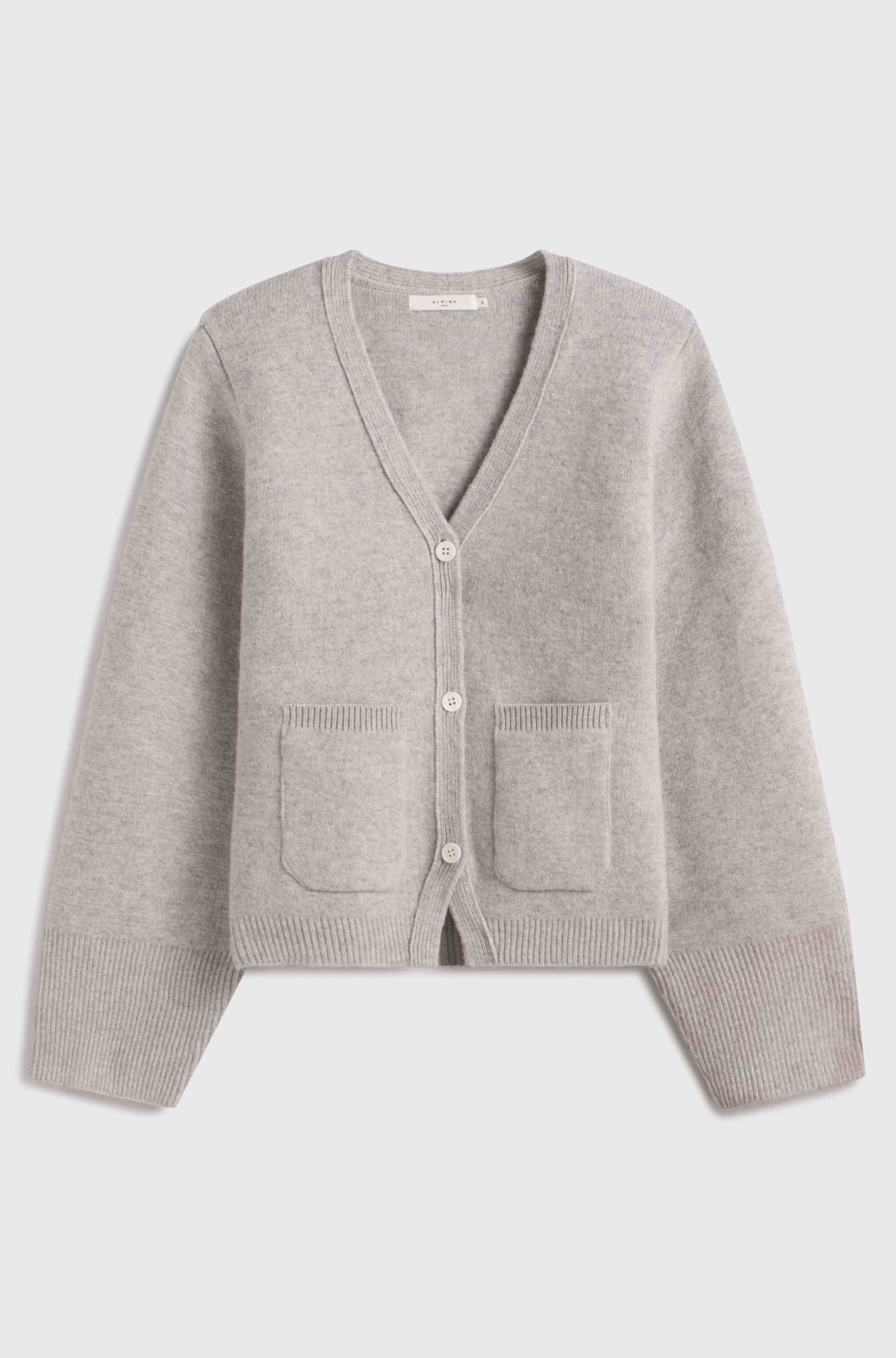 Gray cardigan with button details on a light gray background