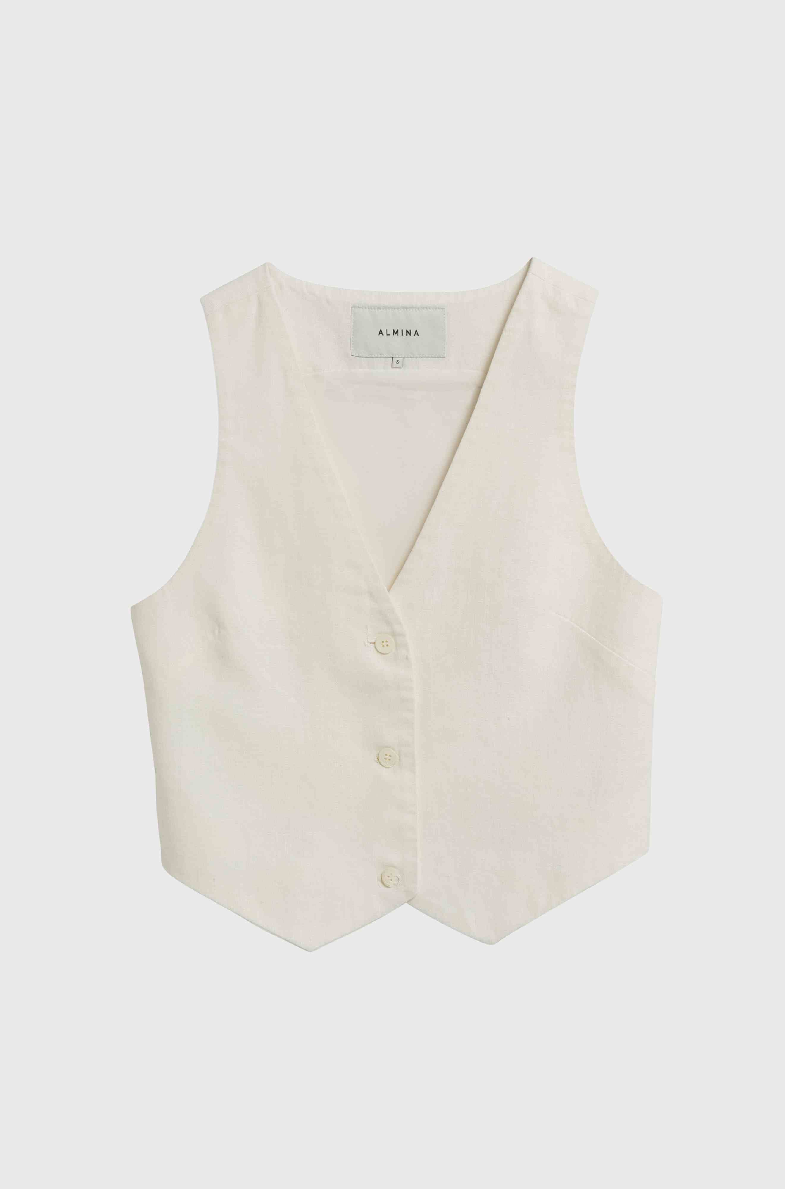 White linen vest against a light grey background