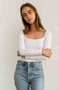 Woman wearing a white long sleeve