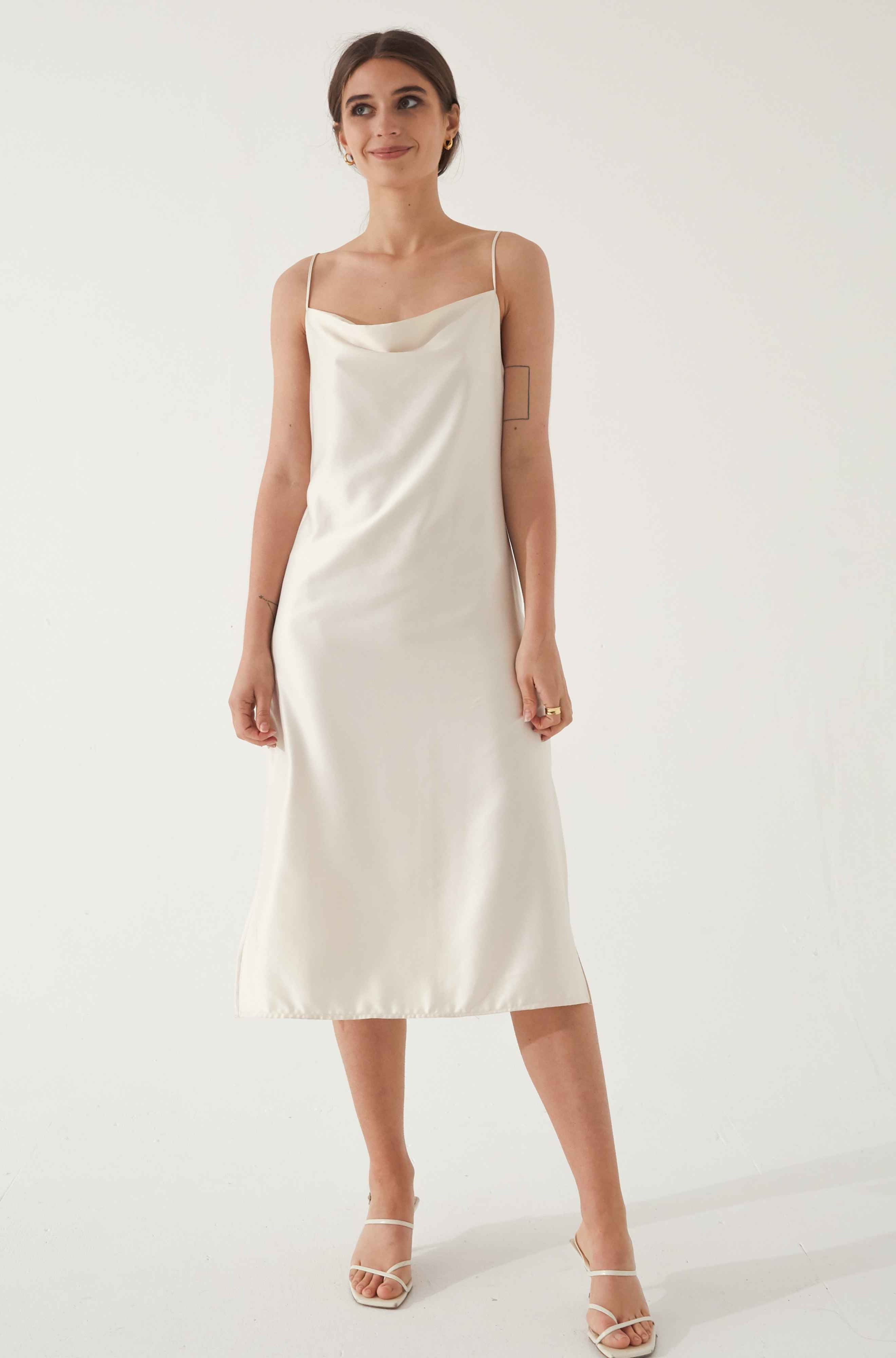 Woman wearing a white silk dress