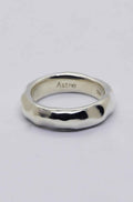 Silver ring on a light grey background