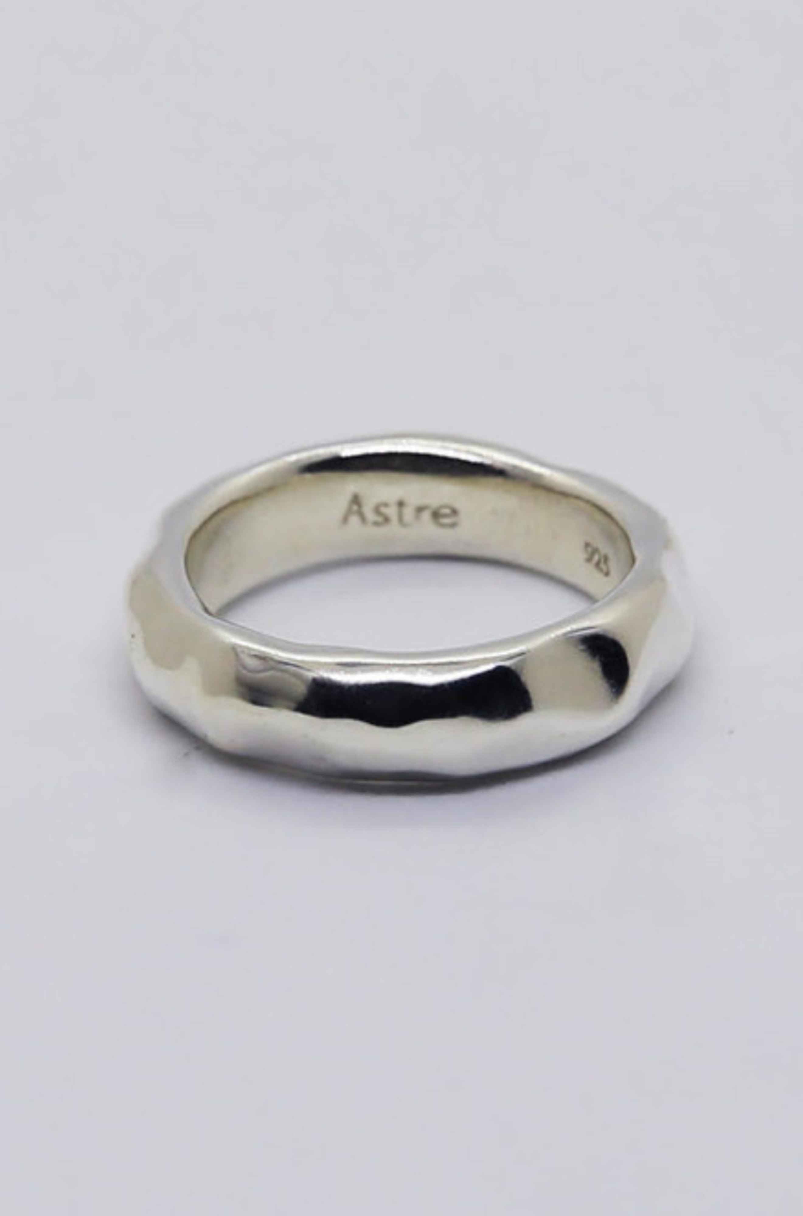Silver ring on a light grey background