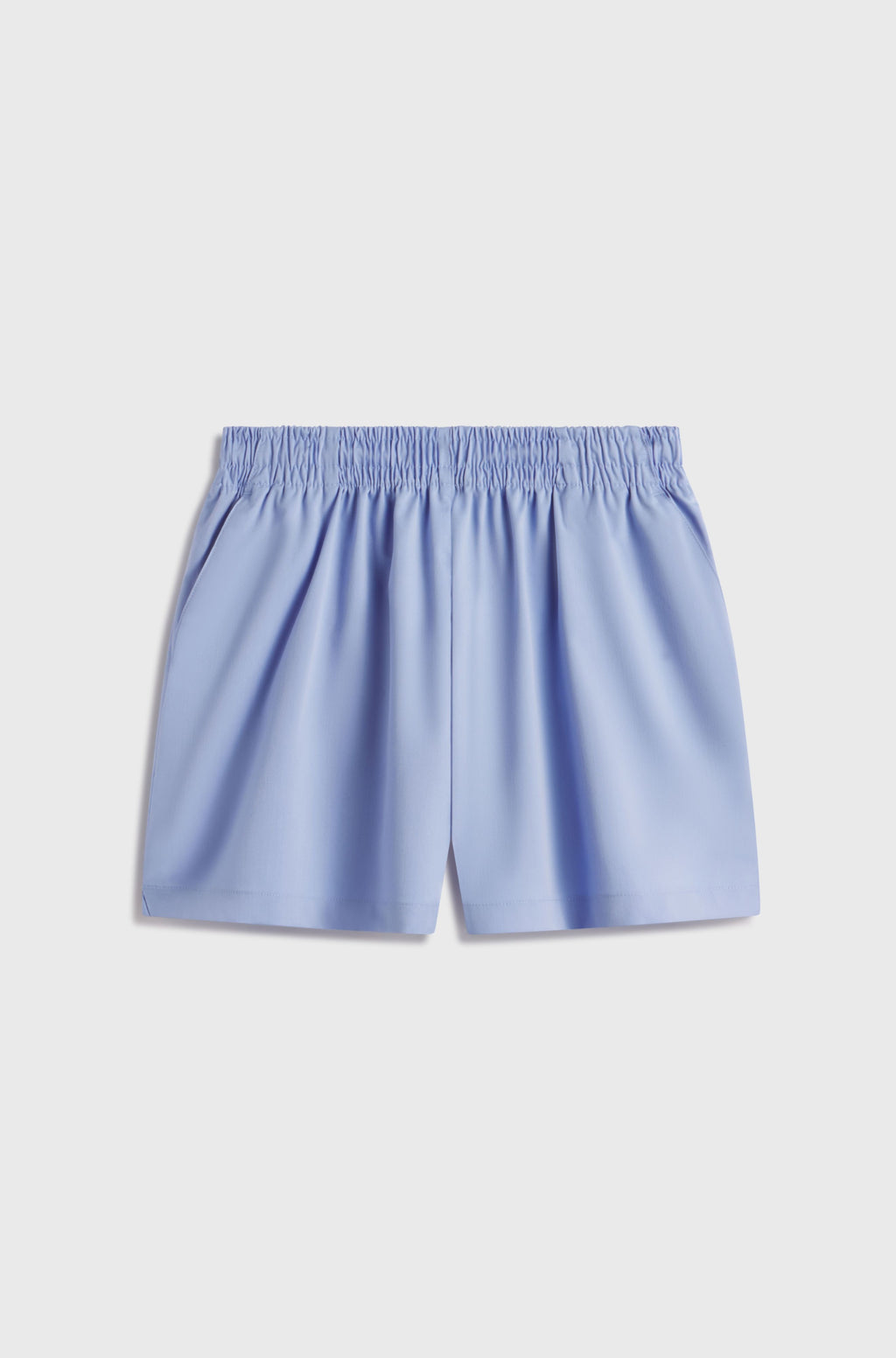 Light blue shorts on a light gray background