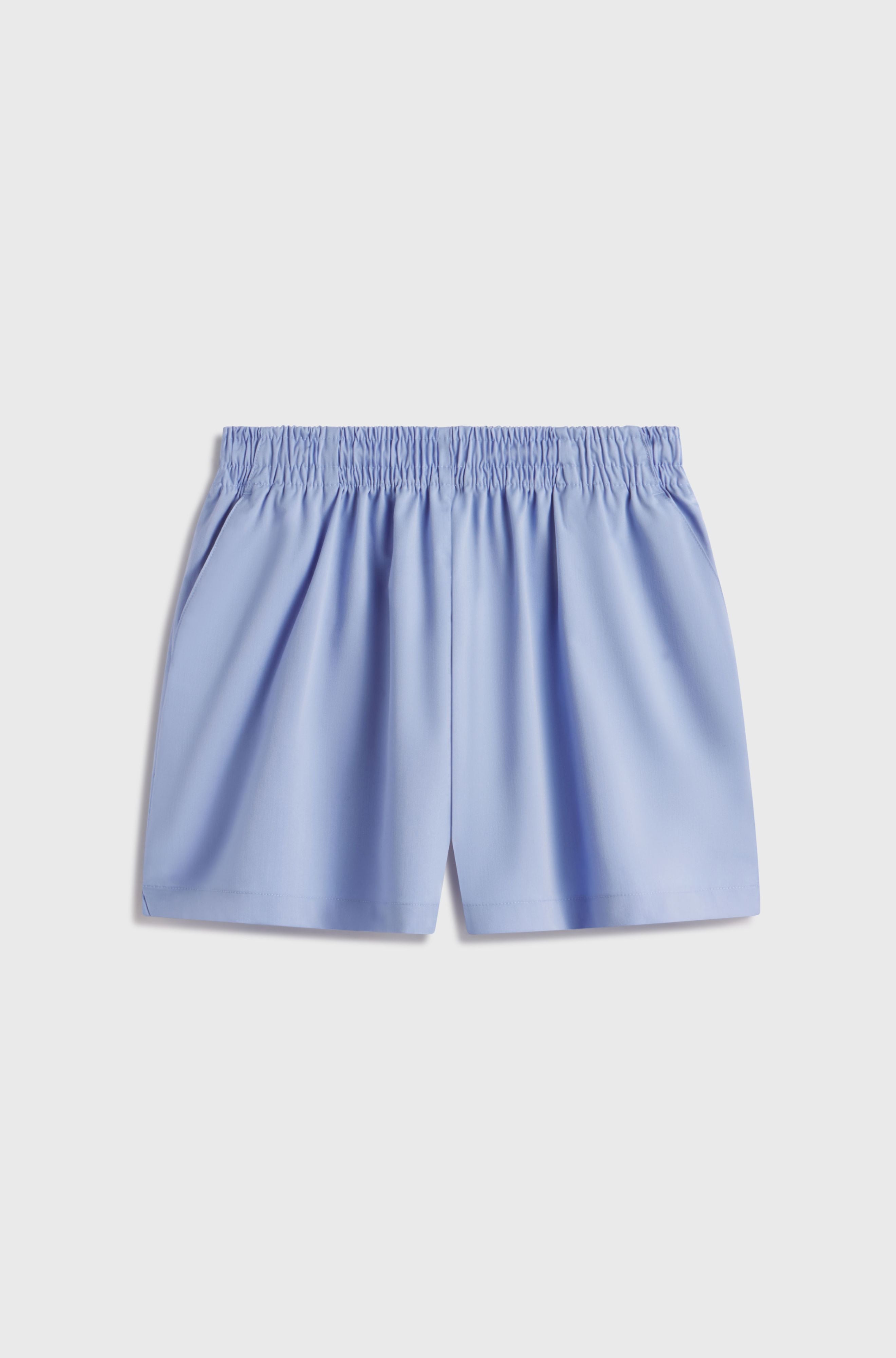 Light blue shorts on a light gray background