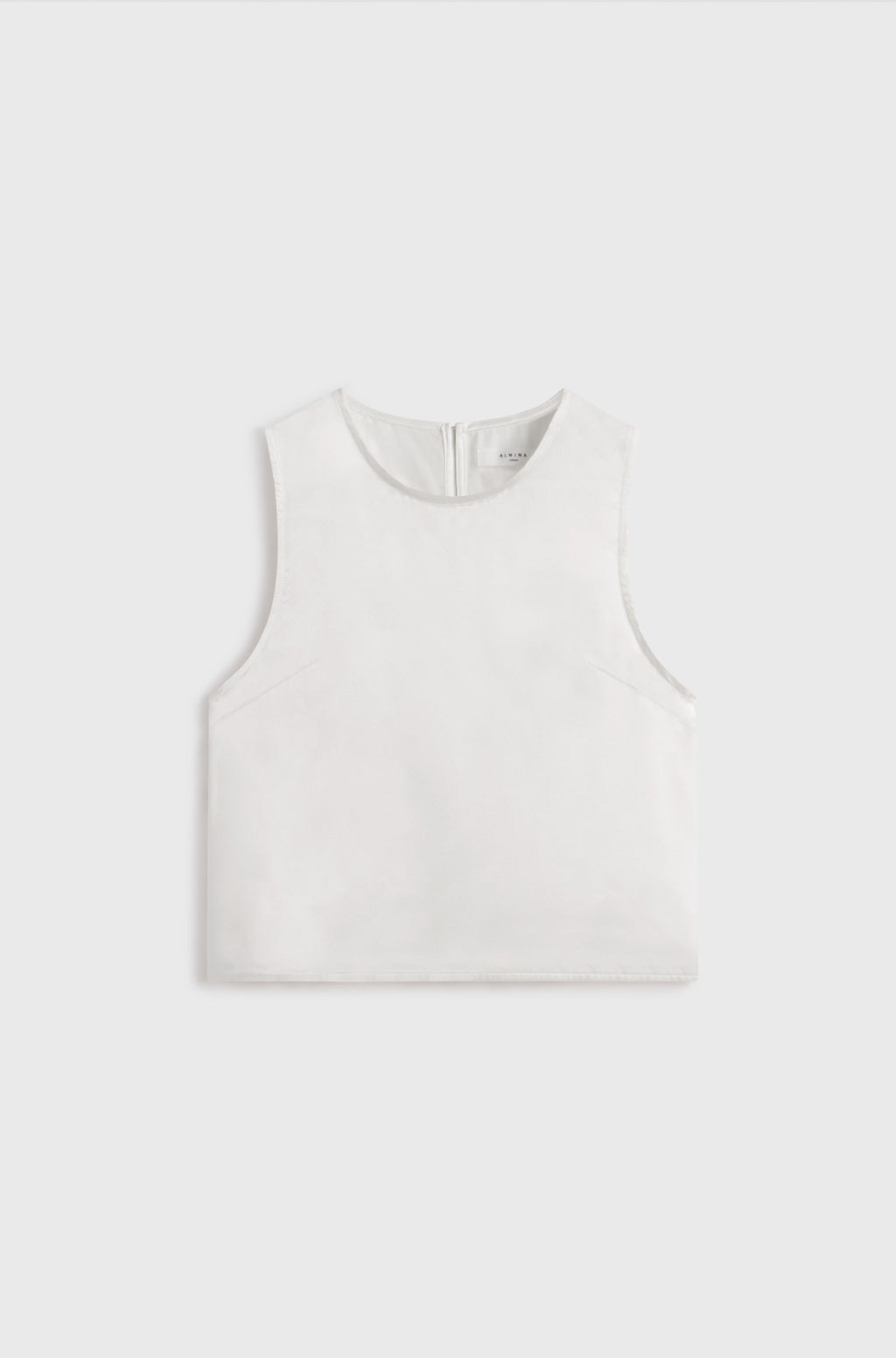 White silk tank top on a light gray background