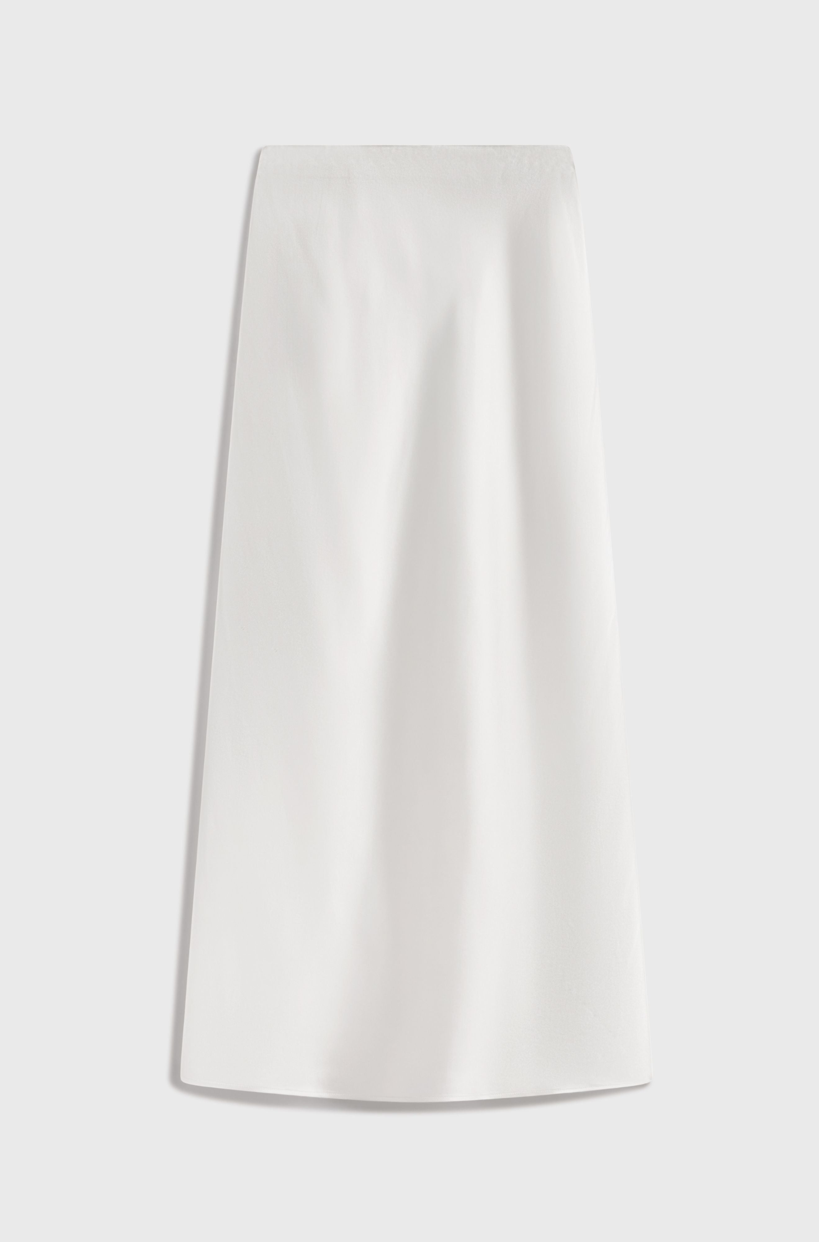 White silk skirt on a light gray background