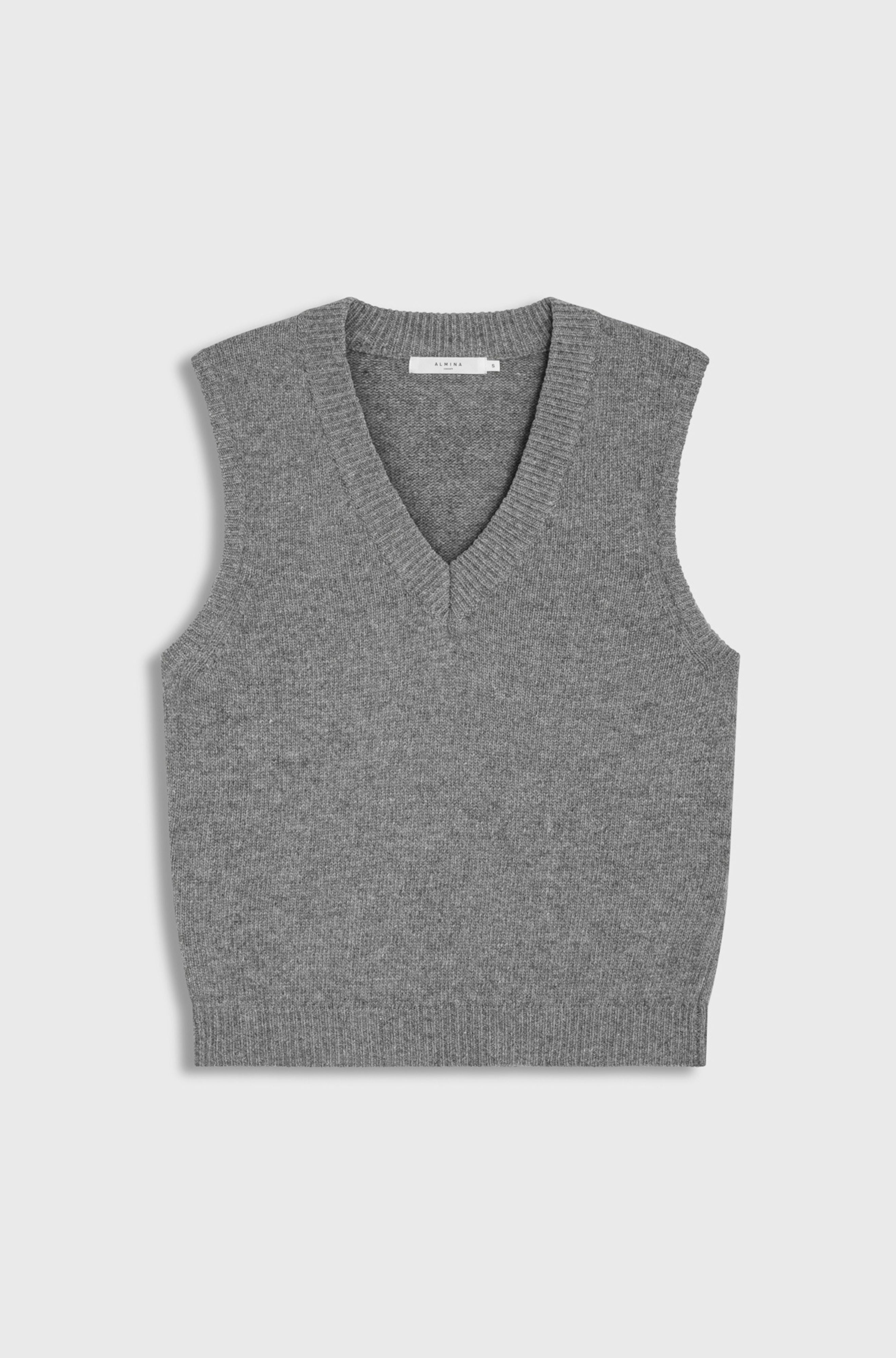 Gray sleeveless sweater vest on a light gray background