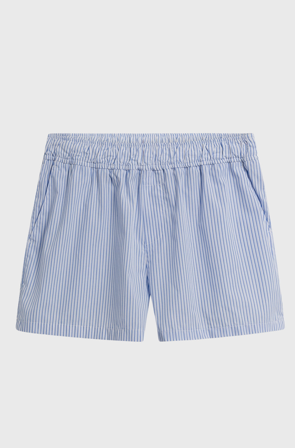 Blue and white striped shorts on a light gray background