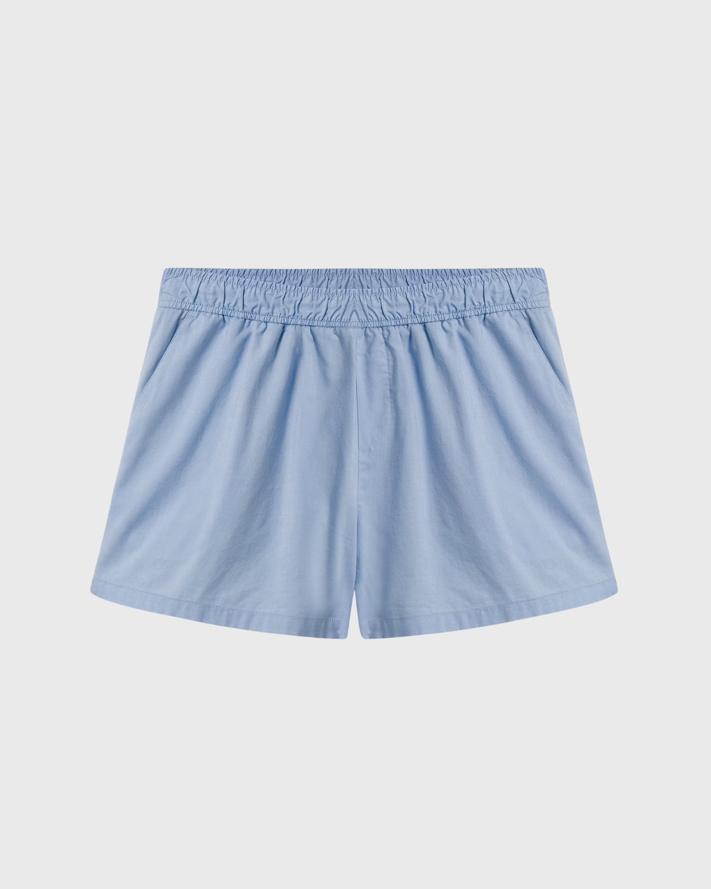 Light blue shorts on a light gray background