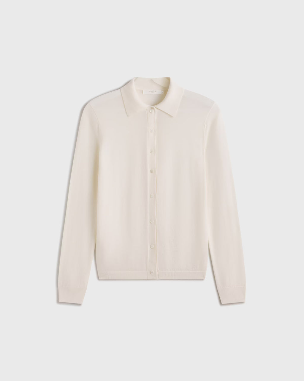 Beige long-sleeve shirt on a light gray background